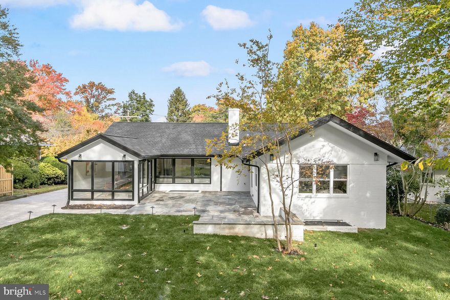 Step into luxury at 3400 Pauline Dr. in Chevy Chase! Nestled in the coveted Rollingwood neighborhood, this mid-century contemporary masterpiece has undergone a stunning transformation to seamlessly blend timeless design with modern living. Boasting a professionally landscaped quarter-acre lot, this residence invites you to indulge in a lifestyle of opulence.
Every inch of this unique home exudes mid-century cool, from the light-filled main level with continuous hardwood floors to the meticulously reimagined spaces. The open floor plan effortlessly connects the living room, kitchen, and dining area, leading to a charming courtyard-style flagstone patio—an entertainer's paradise.
No detail is spared in the chef’s kitchen, featuring an oversized island with seating for six, Carrara Quartz countertops, and top-of-the-line GE Profile Stainless steel appliances. The main level is a haven of comfort, hosting four spacious bedrooms and two and a half baths, with the primary bedroom offering access to the patio, a soaring ceiling, a luxurious bath, and a walk-in closet.
Descend to the fully finished lower level, where a large recreation room with a second fireplace awaits, along with a built-in wet bar, an additional bedroom, full and half baths, laundry facilities, and ample storage. The home is crowned with a new roof, electrical heavy-up, EV charging port, and night-time focus lighting on the exterior.
Outside, a spacious driveway accommodates multiple cars, complemented by a shed and ample space for a potential swimming pool. Beyond the luxurious features, enjoy the convenience of being minutes away from Washington DC, Friendship Heights, Bethesda, and easy access to 495. Embrace the commuter's delight and retreat to perfection in this Rollingwood gem, where every detail has been carefully curated for maximum impact.