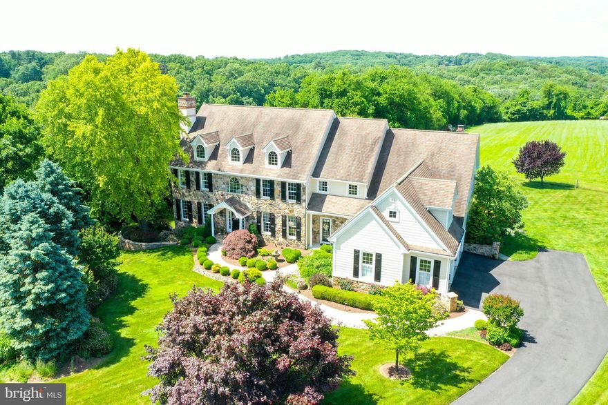 Exquisite 5-bedroom, 5.2 baths Estate home set back in a cul de sac & on an Amazing lot backing to 60 plus acres that are deed restricted and under act 319 in the Unionville Chadds Ford school district. Designed, updated and meticulously maintained all with New Hardie Plank EXTERIOR & New Windows, located in Birmingham Township & is conveniently located in Longview at Wylie. This gracious floor plan will not disappoint!  1st Floor offers an open floor plan with newly finished hardwood flooring, moldings, curved cased doorways & wainscoting. The Formal front to back foyer offers rear access to the New Trex deck and the private office with moldings,  and side French door to Trex deck. The formal Living Room with gas burning fireplace, moldings and access to wet bar for all your entertaining and formal powder room! Formal Dining Room with expanded windows & custom moldings. This Open Gourmet Kitchen provides a well thought out space designed for entertaining, offers Stainless Steel Decor appliances, 6-burner Wolf gas range, Subzero refrigerator, granite counters, custom 2-toned Wood Mode cabinets, upgraded lighting, all open to large Breakfast Room with French door to rear deck, and 2nd staircase to upper level. The Family Room is warm & cozy with stone gas fireplace, custom built-ins, and side door to porch & driveway area. The Mud Room, with a private Laundry Room with built in cabinetry and granite counter tops, 2nd powder room, extra closets, Large walk-in Pantry & access to the garage! The Formal stairs take you to the Private Master Suite that offers a master sitting room with custom built-ins, 2- walk-in closets, and an updated AMAZING SPA bathroom with 3-side glass shower, soaking tub, custom his-her cabinetry & lighting all designed for a stunning master bathroom all with views that will wow you!  Four additional bedrooms, generous sized closets with Private Bathrooms and 2 share a Jack/Jill bathroom.  Access to 3rd floor for extra storage or room to finish. All bedrooms easily access the rear stairs to Kitchen & Family Room area. Finished Lower level with full windows and rear French doors to yard.  This Lower level offers a 2nd Family room, gym area, Built-in custom Bar and Bathroom.  This home offers breathtaking views of the countryside from every window! Enjoy the rear New Trex deck, with rear steps to yard, all backing to open space. Professional Landscape with outdoor lighting. This home will not disappoint! Great access to roadways, shopping airport and More! Award winning Unionville -Chadds Ford School with Pocopson Elementary!