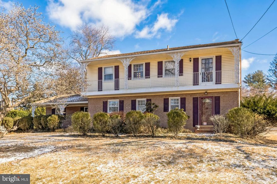 A classic Wayne colonial, perfectly positioned on a tree lined street is searching for its new owners. Drive up to this beautifully landscaped property and envision yourself enjoying the comfort of a covered porch. When you enter the home's front entrance into the foyer, you are welcomed by gleaming wood floors and a convenient coat closet. Just off the foyer is the powder room. Step into the formal living room with a wood burning fireplace and hardwood floors. Across the living room is the dining room, which has crown molding, a chair rail and French doors that take you out to the relaxing patio which overlooks the large, lush level backyard. The eat-in kitchen features granite counters, stainless steel appliances, a side entry door and upgraded recessed lighting. There is also a bonus room that could be used as a breakfast room or a lovely spot for a home office. Moving up to the 2nd floor, you will love the hardwood floors that run throughout. The primary bedroom has a walk-in closet, en suite bathroom with shower stall, and access to the balcony. There are 3 additional, nicely sized bedrooms and a hall bathroom with a tub/shower combo that services them. Before you leave, head down to the finished basement which offers plenty of extra living space, a bonus cedar closet, a laundry area, and additional storage space. With so many great features, a 2-car garage, shed, central a/c, newer heater (2023) and fabulous lot with an abundance of natural sunlight, this home will not last long. Property is being sold in AS IS condition. Schedule your showing today!