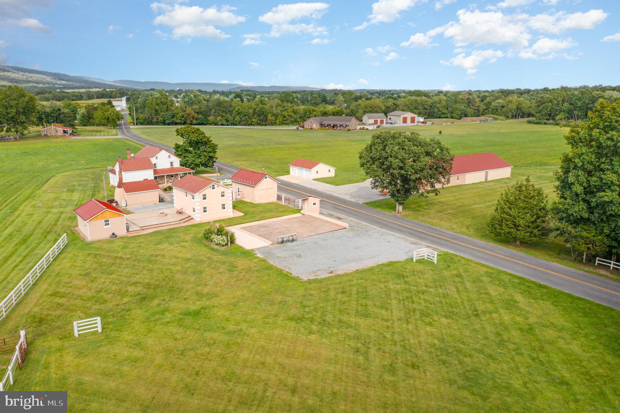 Welcome home to this charming property situated in the Northern Lebanon School District! Boasting nearly 30 acres of picturesque farmland, this property features a lovely 1,927 square feet stone farmhouse with wrap around front porch that was built in 1850, along with additional outbuildings! This property exudes a unique rustic charm that is hard to find. As you approach the property, you will be greeted to the serene beauty of the surrounding countryside and the spacious acreage that allows for endless possibilities. Step inside the farmhouse to find ample living space with wood floors, beams and columns providing for a cozy living space. Kitchen features tile floors, beautiful cherry cabinets, granite countertops, stainless steel appliances, eat-in bar and breakfast space and a pantry cabinet for storage. Main level full bath and laundry with storage. Make your way upstairs to find three generous bedrooms and a full bath. Third level features an attic space for additional storage space. Outside, the property is a farm lover's dream, with plenty of space to explore and enjoy the outdoors! Unfinished basement. Property features multiple buildings including a barn, game room building and summer house for plenty of space. Whether you want to take a leisurely walk through the fields or simply soak up the tranquil ambiance of the countryside, this property has it all. Conveniently located and in close proximity to Hershey amenities, along with nearby access to highways for an easy commute. With its unique blend of farmhouse charm and modern amenities, this property is the perfect place to call home. Metal roof is on schedule to be painted this summer. Property has also held numerous weddings/events and could make a wonderful event venue. Don't miss your chance to experience the peaceful beauty of this stunning property. Property consists of one parcel with 23.09 acres + 6.69 acres. Seller is willing to sell the 6.69 acres separately which has been perc approved, please call listing agent for details and pricing if interested. Truly, a joy to own! Please schedule all showings of this property through ShowingTime and serious buyer's only. Thank you!