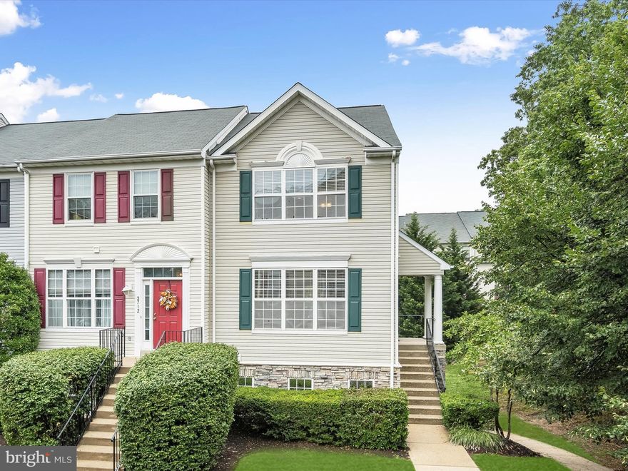 Tucked away in the tree-lined Woodland Walk of Piney Orchard, this renovated end-unit townhome offers a perfect blend of peace, community, and stylish, modern living. Just down the street, walking and biking paths meander toward a nearby playground and community pool, creating an ideal spot for unwinding on a sunny afternoon. Inside, the home shines with a thoughtful, open concept design filled with natural light pouring through its many windows. Beautiful hardwood floors flow effortlessly from the living room, anchored by a warm and welcoming fireplace, into the dining area, creating a comfortable space for both relaxation and entertaining. The renovated kitchen is a true highlight, featuring handsome, soft-close cabinetry that reach up to the ceiling and offers convenient storage with a lazy Susan, built-in dividers, and other custom details. Sleek appliances, including a gas range, combine with upgraded countertops to make meal preparation a pleasure, while a sliding glass door offers easy access to the deck, perfect for dining al fresco. Completing this level are a convenient powder room and laundry room. Venture upstairs to find refuge in the primary suite, a restful sanctuary with a dramatic vaulted ceiling, two walk-in closets, and an en suite bath with upgraded countertop. The upper level also includes two additional bedrooms and a full bath, also finished with a stylish, updated countertop. An assigned parking space in addition to visitor spaces allow for effortless parking for you and your guests. Piney Orchard offers a rich array of community amenities, from a modern community center with a fitness facility, event spaces, and an indoor pool with a hot tub, to multiple outdoor pools for summer fun. The neighborhood also boasts four tennis courts, two lined for pickleball, five tot lots, vast walking and biking trails that wind through its 45-acre nature preserve, nearby athletic fields, and a weekly summer farmers’ market. Ideally situated for convenient commuting, Piney Orchard provides easy access to major routes, making your daily drive a breeze while still retaining a strong sense of community and peace at home. Please note: photos depicting furniture have utilized virtual staging.