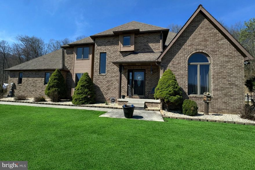 Welcome to your own private mountain-view retreat—where luxury, space, and convenience come together in one unforgettable package! Nestled on over 13.5 acres in LaVale, this stunning 4,000+ sq ft contemporary has been impeccably maintained and delivers the perfect blend of elegance, comfort, and privacy—just minutes from shopping, dining, and I-68 access.
Step inside and prepare to be wowed by the dramatic great room featuring soaring cathedral ceilings, gleaming oak floors, and a striking double-sided gas fireplace—a true showstopper and the heart of the home. The layout flows beautifully into a chef’s dream kitchen with granite countertops, oak cabinetry, gas cooktop, double wall ovens, island + peninsula, and an inviting breakfast area.
The main-level primary suite is a peaceful escape, offering serene views of the backyard oasis and a spacious en-suite bath. The main level also includes a formal dining room, formal living room, den, sunroom, laundry room, and half bath—providing flexibility for both everyday living and entertaining.
Upstairs, you’ll find two generously sized bedrooms connected by a Jack & Jill bath, plus a large loft overlooking the great room—perfect for a home office, reading nook, or additional lounge space.
The lower level boasts a massive rec room, ideal for game nights, a home theater, or gym setup.
Outside is where this property truly shines—enjoy summer days by the in-ground fiberglass pool (15,000 gallons, new pump & motor 2025), take in the breathtaking mountain views, and appreciate the unmatched privacy of your expansive acreage. The property also features beautiful landscaping, a paved driveway, multiple sheds, and an oversized 2-car garage.
Built to impress with all-brick construction, Andersen windows, a 40-year roof, oak trim throughout, plus modern essentials like public water & sewer, central AC, gas heat, and a radon mitigation system already in place.
This is more than a home—it’s a lifestyle.
Impeccably maintained. Private. Scenic. Spacious. Convenient.
Opportunities like this in LaVale don’t come around often—schedule your tour today!