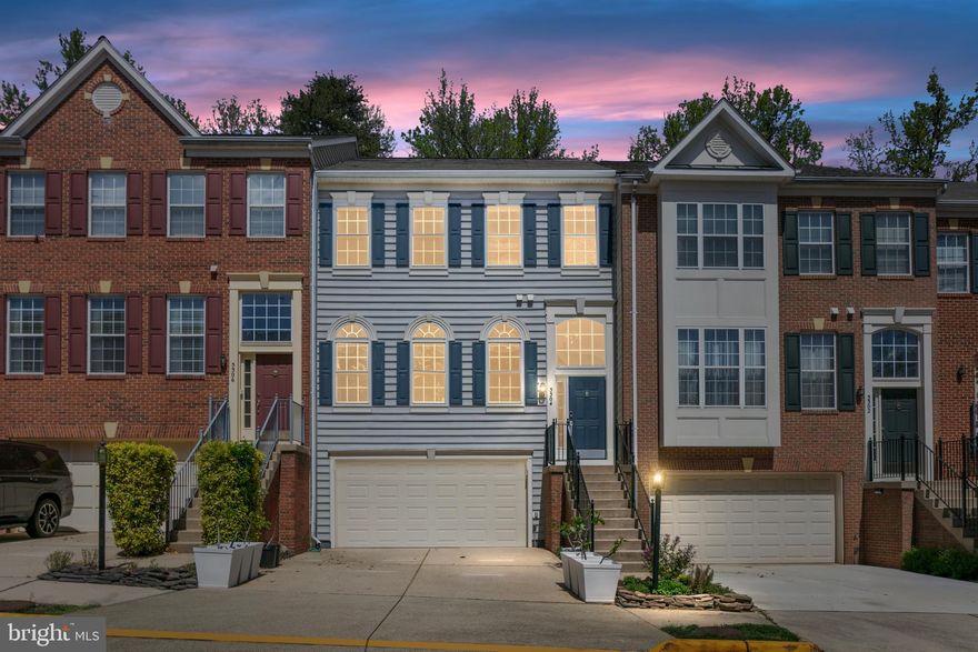 Welcome to 5304 Jesmond St – a beautifully updated townhome in the heart of Kingstowne. Thoughtfully upgraded throughout, this charming home features gleaming hardwood floors on the main and upper levels. At the heart of the home is a stunning remodeled kitchen, showcasing white cabinetry, fingerprint-resistant stainless steel appliances, elegant white quartz countertops, and a functional center island—perfect for everyday meals or entertaining. Enjoy peaceful wooded views through the sliding glass door that opens to a spacious deck—an ideal spot for morning coffee or evening relaxation. The adjacent living area offers a cozy gas fireplace, creating a warm and inviting atmosphere. Upstairs, you’ll find three well-proportioned bedrooms, including a spacious primary suite with vaulted ceilings, a private office nook, expansive walk-in closets, and a fully renovated en-suite bath designed for comfort and style. The fully finished lower level adds valuable living space, complete with new luxury vinyl plank flooring, a full bathroom, and walk-out access to a private patio—perfect for guests, a home office, or a recreation room. Additional highlights include a two-car garage, ample driveway parking, and plenty of guest parking nearby. Recent updates include a new HVAC system (Feb 2023), as well as newer hardwood floors, stairwells, and kitchen upgrades (Nov 2022). Located just minutes from Kingstowne Town Center, you'll enjoy convenient access to shopping, dining, parks, pools, fitness centers, and tennis courts. Close to I-95, I-495, 3.2 miles to Franconia Metro Station and VRE,  1.6 miles to Van Dorn Metro. Commuting is effortless. Don’t miss the opportunity to make this meticulously maintained townhome your next home—offering a lifestyle of comfort, convenience, and charm.