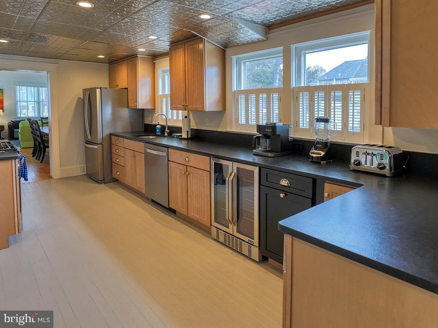 Back on the Market after a Kitchen Upgrade, a beautiful classic home where traditional meets coastal, offering a spectacular location on the second block of the renown Baltimore Avenue, close to the beach, boardwalk, restaurants, shopping, and everything Rehoboth Beach has to offer. This updated 4-bedroom, 4 1/2-bathroom home offers plenty of room for entertaining, with a great room that flows directly into the dining room, a living room, a family room, a sunroom, a bedroom with full bath nearby on the first floor, 3-bedrooms with baths ensuite on the second-floor, full-size front-loading washer and dryer, a fenced yard with a beautiful heated salt water swimming pool, an outdoor shower, a patio with outdoor dining, and off street parking. Updates include a new HVAC system on the first-floor, LG HVAC units in all second-floor bedrooms, laminate flooring on the second-floor, composite decking installed on all entry doors, lawn irrigation system, landscaping with 36-hydrangeas, 4-Crape Myrtles, and 3-evergreen trees, Hunter Douglas blinds throughout the house, several rooms freshly painted, new beadboard paneling, wallpaper, faucet, and shower head  replaced on the first floor full bath, and new light fixtures, shower heads and toilets in all second-floor bathrooms. This property is being sold furnished and turnkey. It is a great investment opportunity that offers an exceptional rental history with $164,000 in 2025 and 101 reviews with a 4.8 Star rating online!  Don’t wait, call to schedule an appointment today!