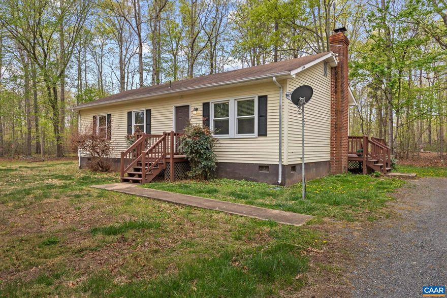 Tucked along Spotswood Trail in Orange County, this 3-bedroom, 2-bath ranch sits on a spacious 2-acre lot offering both convenience and opportunity. Inside, you?ll find hardwood floors and a cozy woodstove that anchors the main living space with warmth and character.  The generous driveway provides ample parking and opens the door for a future detached garage or workshop. With solid bones and room to personalize, this home is ready for your vision and updates to truly make it your own.  Enjoy the best of both worlds?peaceful country living just 15 minutes from shopping, dining, and everyday essentials in the Ruckersville area, including Lowe?s, Walmart, and Starbucks.  Bring your ideas and unlock the potential of this Orange County gem.,Painted Cabinets