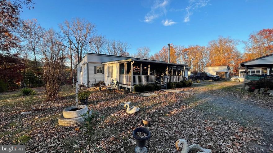 Call now to see this spacious affordable 4 bedroom manufactured home with addition on 5.9 acres. There is a living room, kitchen/dining combo. laundry room and a front porch. Several outbuildings convey. Property is mostly wooded.