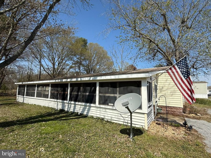 Discover this cozy 2-bedroom, 1-bathroom mobile home, perfect for comfortable living. Featuring a large screened-in porch, you can enjoy fresh air year-round without the hassle of bugs! Conveniently located near restaurants, shops, and essential services, this home offers both comfort and convenience. Don't miss out on this affordable and well-located gem!