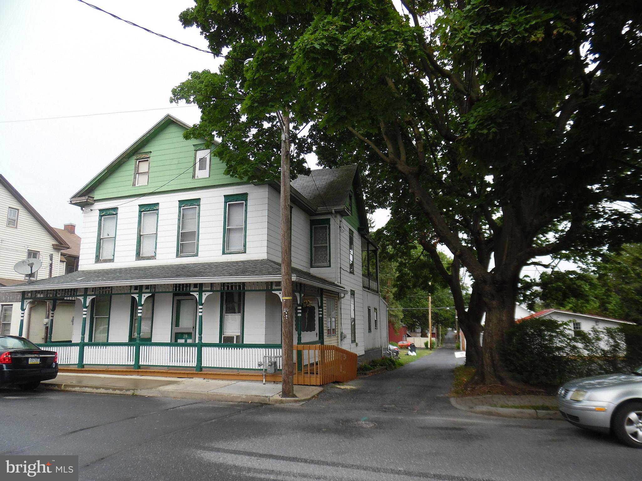 An unusual opportunity in Annville. This property consists of TWO houses on one deed and a lot with road frontage on 3 sides. The homes share a sewer line but are not accessible to each other. 28 has living room, kitchen, front room currently used as a bedroom, first floor bath and dressing room. There are 3 bedrooms on the second floor and a small bath that has not been used in many years. the back bedroom has balcony access. Both sides have a full attic and basement. The basement in 30 has a ground floor, 28 is cemented. the floorplan on the north side (30) consists of front room, living room, eat in kitchen on the first floor, 2 bedrooms and bath on the second floor. This home is an estate and is being sold AS IS. The heat is provided by Warm Morning gas heaters, one in each side. From 4/1 to 4/14/25 please refer all calls on this property to Tommy Bechtold.