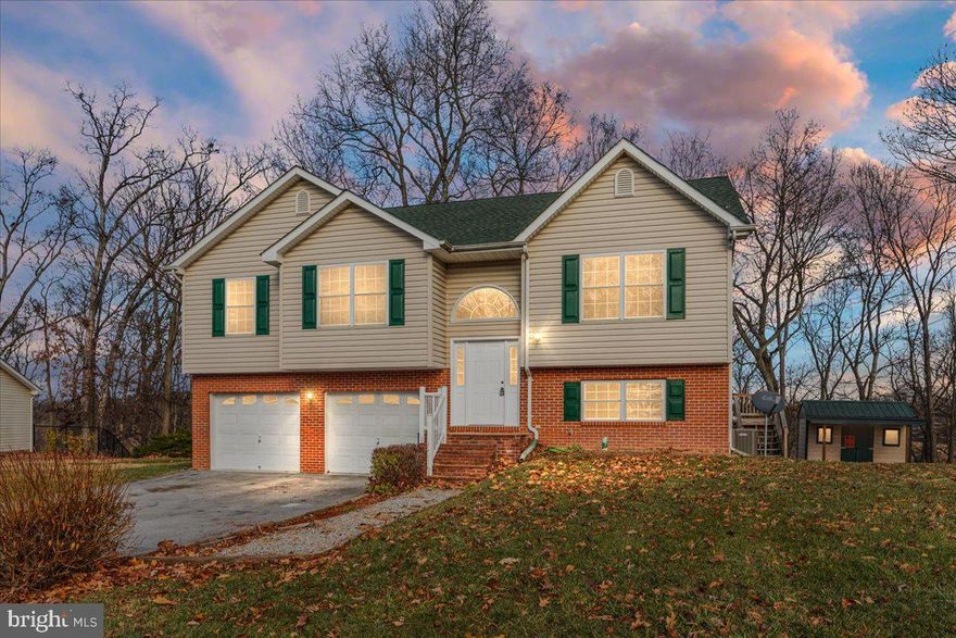 Don't miss this beautiful home  situated on a 1.12 acre lot with a private backyard.  The main level features a  gorgeous kitchen with new stainless steel appliances, tile back splash and center island. A separate eating space and family room adjoin the kitchen.  Down the hall, three bedrooms and two full bathrooms provide comfortable and accessible living spaces. The basement boasts recent updates, including new carpeting.

Outside, a vast two-tier deck offers views of the private wooded backyard, providing the perfect setting for relaxation and entertainment. The property also includes a storage shed, ideal for tools or as a potential woodworking space. 
The oversized, 2 car garage features workbench space and peg board for the organization of your tools.  

This home has received a fresh coat of paint and numerous updates including: NEW luxury vinyl plank flooring, ceiling fans, light fixtures, stainless steel appliances, and blinds. The roof is 5 years young!

Don't miss out on the opportunity to make this beautiful, updated home yours. 
Don't Delay! Schedule your showing!