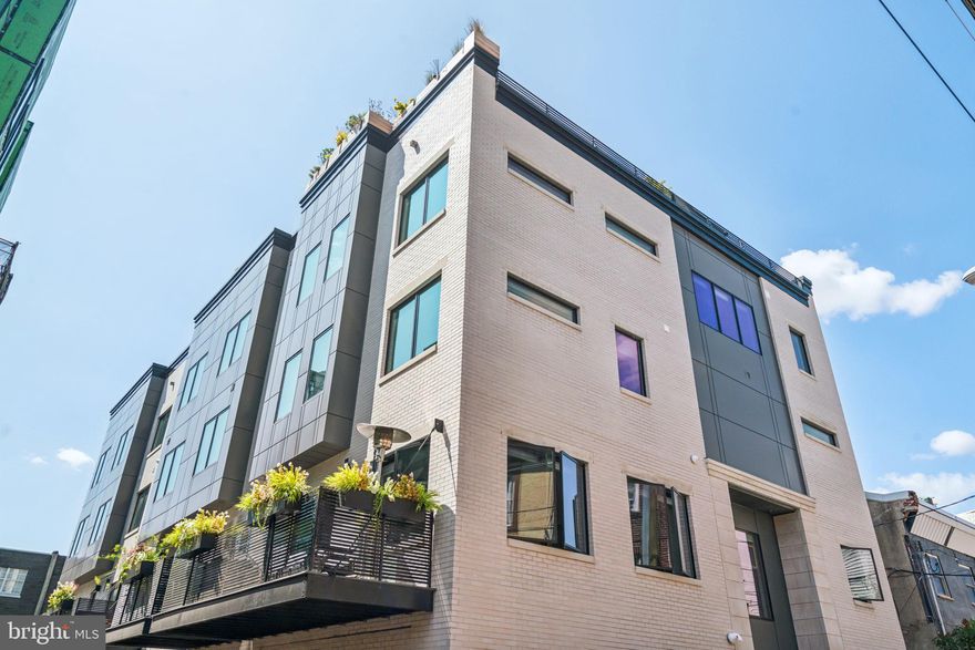 The Passyunk Crest townhomes are truly one-of-a-kind, offering a rare opportunity to live in a development as unique as the neighborhood that surrounds it. These distinctive homes are nestled in the heart of East Passyunk, one of Philadelphia’s most sought-after and dynamic neighborhoods, celebrated for its vibrant restaurant scene, eclectic indie boutiques, and dynamic arts and culture. From the sleek architecture to the thoughtfully curated interior design, every element exudes a character as unique as yours. Unit H features 4 bedrooms, 3 full and 2 half baths, and spans over 3,600 square feet. Designed with both luxury and functionality in mind, this home offers multiple outdoor spaces, including a private deck and rooftop terrace, and the convenience of a 1-car garage with additional driveway parking. Inside, the chef’s kitchen and spacious primary suite provide the perfect setting for comfortable, modern living. The expansive four-story layout offers endless possibilities to customize the space, whether for a home gym, nursery, or office. Step outside your door, and you'll find yourself on the bustling Passyunk Avenue, a culinary haven featuring nationally recognized eateries like Laurel, Fond, and Palizzi Social Club, as well as casual favorites like Pistola’s and Del Sur. Shop local at charming boutiques like Occasionette, Lume Creative, and Urban Jungle, or enjoy coffee and dessert at spots like Black & Brew and Vanilya Bakery. For sports enthusiasts, Passyunk Crest offers unparalleled convenience, located just a short drive or bike ride from Lincoln Financial Field, Citizens Bank Park, and the Wells Fargo Center, making it easy to catch a game or concert. With its prime location, luxurious finishes, and the dynamic energy of East Passyunk at your doorstep, Passyunk Crest is more than a home—it's a lifestyle.