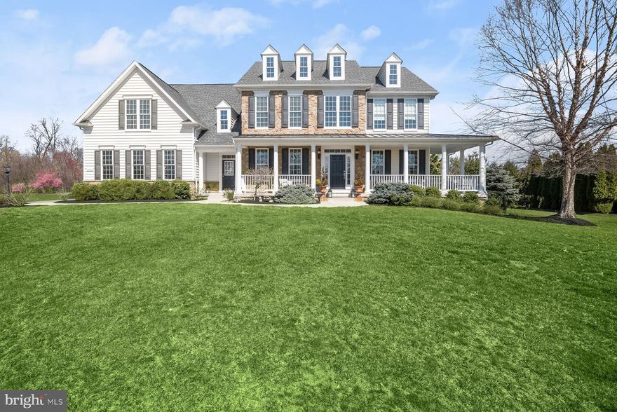 The one you've been waiting for is here in Cloverfield.  Catonsville Builders quality construction and attention to detail encompass the beauty in this lovely home originally was to serve as a model, now offered by the original owner.  Partial wrap front porch entry framed by stone accents, offers a peaceful view of the surrounding homes and landscape.  Two story foyer will impress all who enter, flanked by formal DR and LR you will immediately notice the substantial mouldings, arched transitions, over-sized base and window trim.  LR a perfect setting for cozy conversation. Formal DR with tray ceiling highlighting significant chandelier leading to beverage bar and cabinetry onto an amazing kitchen.  An abundance of Homecrest custom cabinetry with contrasting perimeter and island finishes.  The breakfast bar joins the large sun room with commanding views of the rear private, level yard.  Marble farm sink, granite counters, Bosch dishwasher, over-sized island with storage on both sides, meal sized Wolfe microwave drawer and desk nook,  Wolfe gas range with burners, griddle and oven, stainless exposed vented range hood with variable lighting and fan speeds. Counter depth Subzero double door column installation of separate refrigerator and freezer. Walk-in pantry.  The kitchen opens to the FR with stone framed gas fireplace, impressive mantle; substantial coffered ceiling anchors a unique wall art framed application.  Formal library with French doors and transom.  Rear split stair to upper-level private spaces.  Primary bedroom suite with tray ceiling, sitting room, walk-in closet room, bath with separate vanities, soaking tub, over-sized dual shower with seating. Additional bedroom with ensuite bath and walk-in closet, two bedrooms with shared bath, large upstairs family room that can easily serve as play space, desk space, guest quarters or fifth bedroom. Full sized laundry room with additional service sink and work space for clothing care.  3-car garage interior access along with front covered porch access to the main level mud room, complete with service sink and cabinetry, foot lockers, personal cubbies and large family closet.  The lower-level offers walk-out access to the rear yard. Ample finished space is  ready for your favorite games or entertainment center,  full bath and rough-in for future wet bar.  The storage room is vast. Over all improvements include Hand Hewn 8-inch planked Hickory flooring throughout the main level, impressive up-graded lighting throughout, over-sized windows, Trex decking, stone patio.  Easy access to Rt. 32 and 144;  neighborhood is only accessed by formal entrance.  This could be your new address.