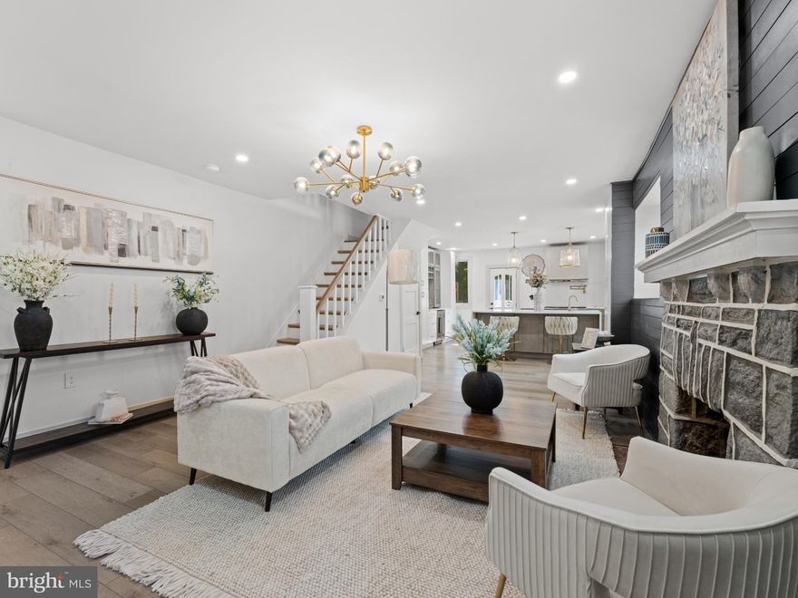 This distinguished five-bedroom, three-bathroom residence in the heart of West Mount Airy combines architectural grace with modern craftsmanship. Situated within one of Philadelphia’s most coveted enclaves, the home offers a rare blend of sophistication, comfort, and style.
Behind its timeless façade lies an expansive, light-filled interior where every element has been thoughtfully designed for both beauty and practicality. The bespoke chef’s kitchen—equipped with premium Thor appliances, a generous island, water filtration system, and custom cabinetry—strikes the perfect balance between elegance and function, equally suited to intimate family suppers or refined entertaining.

Kitchen doors open to a sun-drenched porch and a private rear terrace, creating a seamless connection to the outdoors.
Upstairs, four spacious bedrooms serve as serene retreats, complemented by two spa-inspired bathrooms. The fifth bedroom offers versatility, ideal as a study, nursery, or additional guest room. Further comforts include a dedicated dog wash, a garage for added convenience, and a welcoming fireplace—the perfect backdrop for conversation on crisp autumn evenings.

Nestled within a vibrant yet tranquil neighbourhood celebrated for its historic charm, tree-lined streets, and proximity to parks, leading schools, and boutique shops, this residence epitomises refined living in one of Philadelphia’s most desirable area.