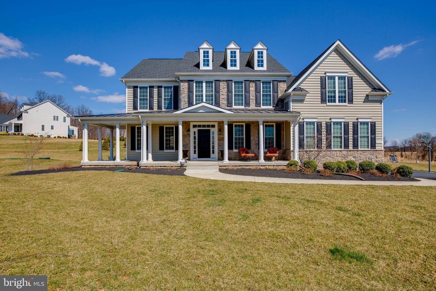 PRICE REDUCED! Lexington Model by Catonsville Homes that backs to preservation area. Exterior features include a partial stone front, covered wrap porch, 3-car side-load garage, 30-year Architectural Roof Shingles, 1,900 sq. ft travertine & bluestone backyard patio that includes a cooking area with built-in stainless steel 42  natural gas grill, sink, storage and cooler, landscape lighting, wood-burning firepit, extensive upgraded landscaping, pet friendly boundaries dog fence installed around property perimeter and in flower beds, built-in adjustable height basketball net and two 4 x8  vegetable garden boxes. Interior features include: 9' ceilings on first, second and lower levels. Hardwood floors throughout first floor and second floor landing. Gourmet Kitchen with high-end granite countertops, large island, auto-close drawers,  upgraded 42" cabinetry with under cabinet lighting, upgraded lighting fixtures and door hardware. Spacious  12 x 20 Morning Room. Family Room with 12' coffered ceiling & stone-surround gas fireplace. Upper level 4 BRs & 4 Baths. Plantation blinds throughout first floor and on landing on 2nd floor. Custom Venetian Blinds on all other 2nd floor windows. Custom built-in closets in 2 bedrooms. Built-in,  His & Hers closets in MBR. Second office in MBR can be converted to 3rd closet in master suite Upgraded bath tub in Master bath. Upgraded finished lower level with wood floors and fully equipped and furnished media room wet Bar and full Bath.  Home security system with motion detector. Pool Table conveys.