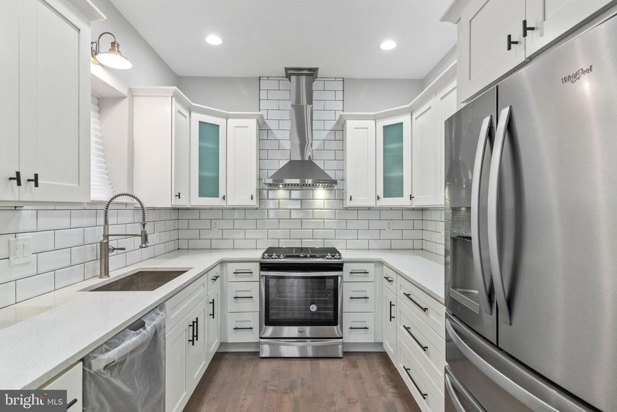 Step into luxury living at the heart of Pennsport! This fully renovated townhome is a true masterpiece. The first floor unveils an open concept, with hardwood floors throughout, with a spacious living area flowing seamlessly into the gourmet kitchen boasting stainless steel appliances, white subway tile backsplash, white cabinets, and breakfast bar. Convenience meets style with a half bath on the first floor. Ascend to the second floor, where you'll find a designated laundry closet, a full bath, and two bedrooms—one with a private balcony. The third floor boasts a spacious primary bedroom with an ensuite bath and an additional retreat-like bedroom. Head to the finished basement, a versatile space for a den, gym, or your work-from-home sanctuary. Just steps away from local favorites like Aroma on 3rd, Dolores, Federal Donuts, Herman’s Coffee, and Dickinson Square Park! Additionally, enjoy a short stroll to Target, Giant, Home Depot, and more. With easy access to bridges, I-95, and 676, this is the epitome of convenient city living.