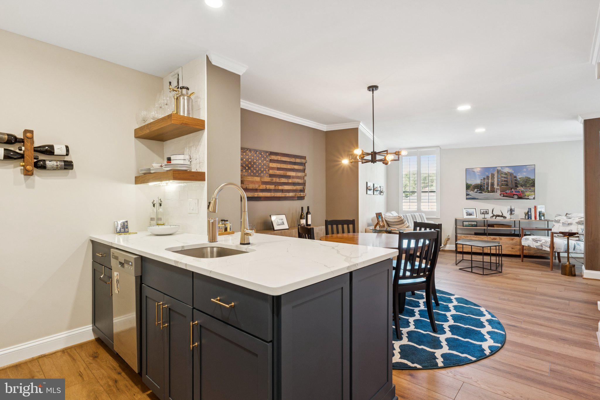 Stunning, to the studs, complete renovation completed in 2021!! You will simply not find a better condo in a better location at this amazing price!! The renovation was meticulously designed and completed to beautifully balance style and function. Not a single sq. inch is wasted, and you will be amazed at the flow and feel of the condo. Custom cabinets, quartz countertops, SS appliances, solid wood doors, hardwood floors, shiplap accent wall....it has it all!! The bathroom is exquisite with a glass-enclosed shower and stunning designer tile. A perfectly executed walk-through closet from the bathroom to the bedroom provides awesome closet space! We haven't even talked about the building! ELEVATOR condo with rooftop patio AND separate rooftop pool AND marina!! The views are breathtaking and expansive from the patio and pool!! Priced perfectly for a quick sale, do not hesitate on this one!! Come see for yourself...quickly!!