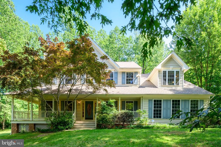 *****SIGNIFICANT PRICE IMPROVEMENT****** Just In Time For the Holidays!!!! This house comes with a REDUCED RATE as low as 5.375% (APR 5.5%) as of 10/13/2025 through  List & Lock™.****  This is a seller paid rate-buydown that reduces the buyer’s interest rate and monthly payment. Terms apply, see disclosures for more information.
EMBRACE  this exceptional  three-level Colonial home WITH RARE MULTI GENERATIONAL LIVING OPPORTUNITY OR  PRIVATE IN LAW SUITE WITH A SECOND KITCHEN nestled in the prestigious Loch Haven Woods Subdivision of Edgewater; with the additional Bonus offerings of a Family Oriented Community. Private, Wooded  Corner Lot in a Cul- De- Sac. With minimal traffic, it is a natural setting with privacy, and a safe place for families with children. 
Set on a serene wooded lot, this home offers incredible curb appeal with its full wrap-around porch, ideal for quiet mornings or sunset conversations. A screened-in porch with skylights creates a tranquil outdoor living space that brings in natural light and fresh air throughout the seasons.
 Inside, the residence shines with modern updates and timeless character. The gourmet kitchen has
 been beautifully renovated and now serves as the heart of the home--an elegant, highly functional
 space perfect for the Chef, Baker, Entertainer, and Family gatherings alike. It's a space designed to
 inspire culinary creativity while offering a warm and welcoming atmosphere for all.
The upper level of the home is equally impressive, featuring a massive primary bedroom retreat complete with a cozy sitting area—the perfect spot to unwind with a good book or enjoy peaceful moments at the end of the day. Three generously sized secondary bedrooms provide comfortable accommodations for family members or guests. Adding to the thoughtful design is the convenience of a laundry chute, making daily chores effortless and adding to the overall functionality of the home.
 Downstairs, the fully finished basement adds incredible versatility with a private bedroom and 
 second kitchen, making it the perfect multi-generational suite or Au Pair living arrangement. Whether
 for guests, extended family, or independent living, this space offers both comfort and privacy.
Recent Upgrades & Features Include:- Updated showers in both the primary and hall bathrooms- New microwave and washer/dryer- New asphalt driveway- Leaf Filter gutter protection for low-maintenance living- Moreover, THE SOLAR PANELS SIGNIFICANTLY REDUCE THE ENERGY COST OF HEATING & COOLING and sustainability.
For commuters, you're conveniently less than an hour to Baltimore, about 40 minutes to BWI Airport,
 and approximately an hour to Reagan National Airport. You'll also enjoy seamless access to all the
 offerings of the Washington D.C. Metro area--from world-class museums and entertainment to fine
 dining and historic landmarks--making this the perfect location for work, travel, and leisure.
 Perfectly located near Marinas, and within Walking Distance to Loch Haven Park, and South River Farm Park. Just  minutes to shopping, dining, and the cultural charm of Edgewater and Annapolis;  including less than a 30 Minute Drive to  the U.S. Naval Academy and within a Hour or Less to Fort Meade, Joint Base Andrews, and NSA.
 This is more than a Home--it's a Private Retreat, a Gathering place, and a Lifestyle upgrade all in one.
 Enjoy the best of Chesapeake Bay Living in one of Edgewater's most desirable communities. BONUS...One Year HSA Home Warranty added for additional Peace of Mind. Sellers prefer to Utilize Bay County Settlements, LLC for Title Work.
WELCOME HOME!!