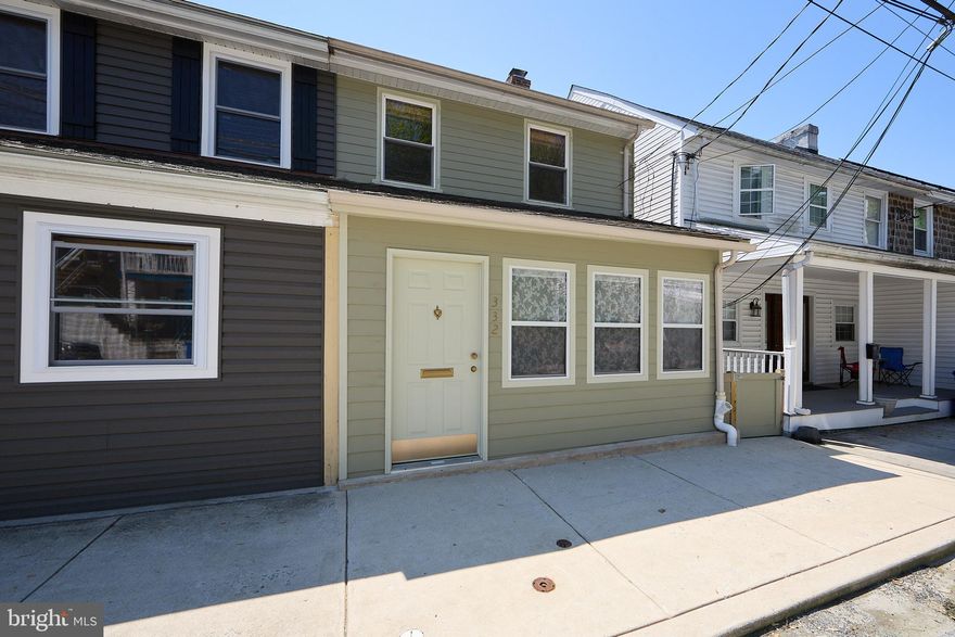 Listing features TWO Separate Parcels- 332 Main Street and 329 North Front Street... Nestled in the heart of charming Parkesburg, this impeccably maintained twin home blends timeless character with thoughtful modern updates.   An added bonus is the separate additional lot included with the property, providing valuable off-street parking accommodating parking for 6-8 Cars and extra convenience rarely found in borough living.  From the inviting enclosed front porch to the beautifully landscaped backyard retreat, every inch of this home has been lovingly cared for and designed for comfortable everyday living. Step inside to find warm and welcoming living spaces highlighted by beautiful hardwood floors throughout the main level. The updated kitchen features crisp white cabinetry extending to the ceiling, greenhouse window, stainless steel appliances, and a new oven that makes both cooking and entertaining a pleasure. The main floor also includes a convenient half bath and inviting spaces filled with character and charm. The second floor offers two spacious bedrooms, including the primary bedroom complete with a cedar closet, along with a full hall bathroom and brand-new carpeting throughout the level. The finished third floor provides a large additional bedroom with another cedar closet, creating the perfect private retreat, guest suite, office, or flex space. The finished walk-out basement is a standout feature, showcasing recently pointed exposed stone walls, a cozy fireplace, and additional living space ideal for a family room, game room, or entertaining area. From here, step directly out to the patio and enjoy the meticulously maintained backyard featuring beautiful gardens and outdoor gathering spaces perfect for relaxing or hosting guests. and extra convenience rarely found in borough living.  Meticulously maintained and upgraded, no detail has been overlooked including a high-end Bosch gas heater.  This move-in ready home offers the perfect blend of historic charm, thoughtful updates, and exceptional outdoor space — all within walking distance close to local shops, dining and transportation. Easy access to commuter routes 10, 30 and 41.
Also Included in this sale - 329 Front St, Parkesburg, PA 19365