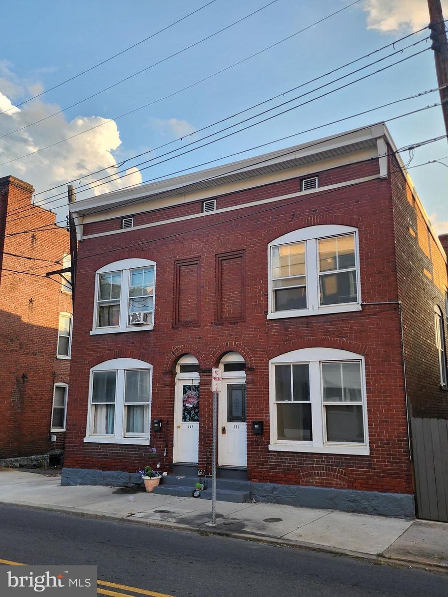 Double the Space, Double the Opportunity! Nestled in the heart of Cumberland, MD, this charming duplex offers the perfect blend of comfort and investment potential. Each spacious unit features 3 bedrooms, 1 full bath, and a full unfinished basement—providing ample storage. Unit 107 is currently rented for $750/month, and with separate utility metering for each unit, tenants pay all their own utilities. Live in one unit and let the rental income from the other help offset your mortgage! Whether you’re looking to expand your investment portfolio or create a smart living arrangement, this property delivers. Call today to schedule your home tour and see the possibilities for yourself! Close to medical, shopping and restaurants!