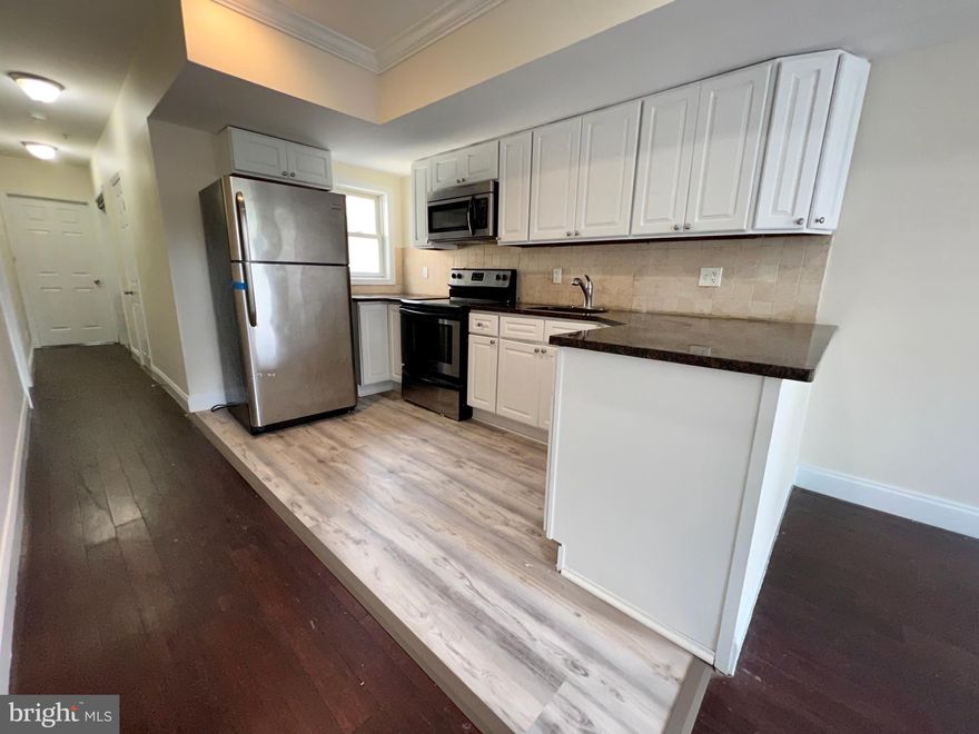 This 4-Bedroom/2-Bathroom apartment is located on the upper levels of a two-unit apartment building just outside Temple University. Only steps away from campus, you'll love being able to walk to class every day! You will also enjoy being surrounded by plenty of public transportation in the area as well. This beautiful apartment is available NOW and ready for immediate move-in!

Enter the apartment and immediately fall in love with the open concept floor plan that exists between the living room and kitchen. There is beautiful hardwood flooring that flows continuously throughout the living room, tall ceilings, and large windows which allow tons of natural light to pour in and make the entire space feel incredibly open and bright.

The kitchen has been recently renovated and looks stunning. It includes stone tile flooring, white cabinets with brushed nickel hardware, granite countertops, stainless steel refrigerator, four-burner gas range, and built-in microwave. There is also a tile backsplash which brings the entire design together!

This apartment includes four spacious bedrooms which all include hardwood flooring, ample closet space, and large windows which allow even more natural light to pour into the home. There are two full bathrooms which ensures there is plenty of privacy for everyone. The renovations continue throughout the bathrooms where you will find stone tile flooring and modern vanities with plenty of storage. The first bathroom includes a full-sized bathtub/shower while the second bathroom includes a shower stall with a custom tile surround!

There is a $75.00 water usage fee due in addition to rent each month. Tenants are also responsible for electric, gas, and cable/internet. Sorry, no pets permitted.

Application Qualifications: Minimum monthly income is 3 times the tenant’s portion of the monthly rent, acceptable rental history, acceptable credit history and acceptable criminal history. More specific information provided with the application.