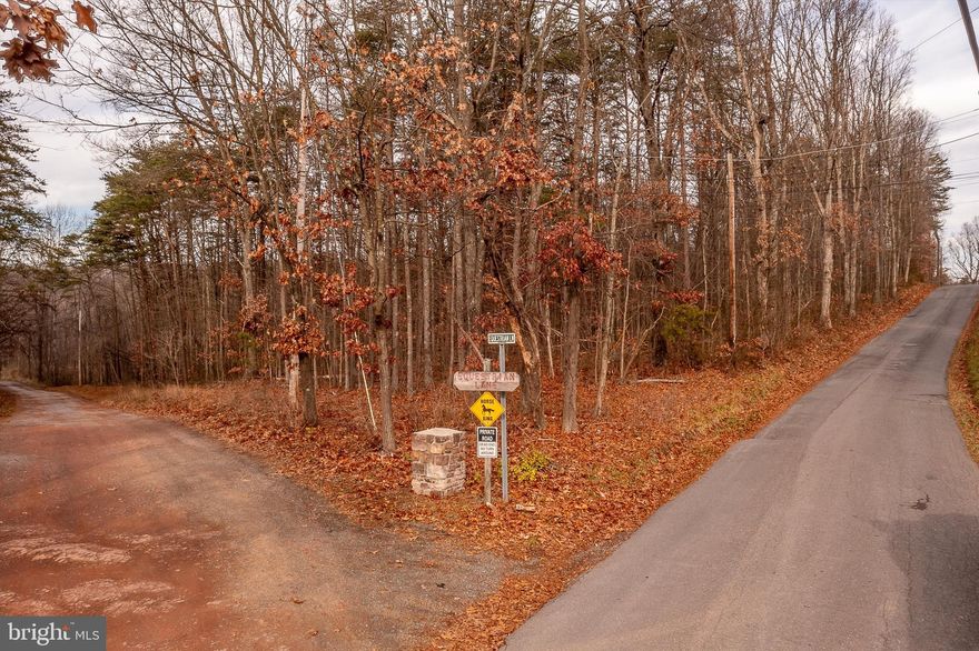 LOCATION LOCATION : looking for a place to build your full-time residence or part-time getaway, this could it. Don't miss this 5.4 acre wooded lot that is located in eastern Morgan Co. / Hedgesville mailing district. This lot is wooded and will give you the privacy you may be looking for. The lot is part of the Spruce Pine Hollow SD but also fronts Michaels Chapel Rd which is a county-maintained road. Property has access to cable / high speed internet. Conveniently located for easy access to all the surrounding areas and tourist towns for street walking and shopping. Also, less than 2 hours from DC & Baltimore, MD.
Cabin pictured is not Habitable.