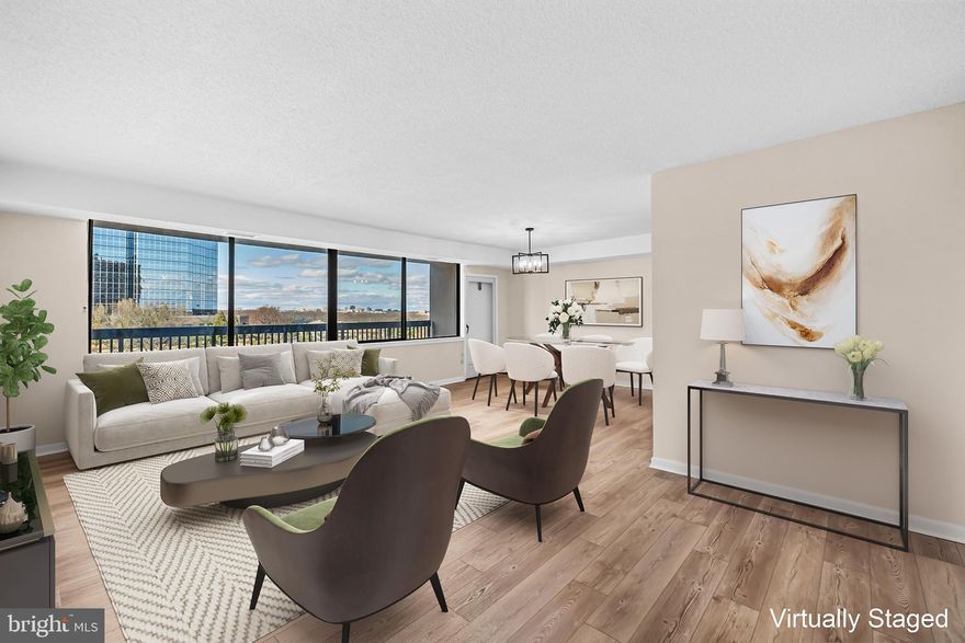 Welcome to this stunning and beautifully updated 2BR/2BA condo at Skyline House!  Spacious at 1,398 sq ft, this move-in ready home features fresh paint throughout and new LVP flooring in the main living areas and kitchen.  A huge balcony and large picture window overlook the bustling Skyline neighborhood as well as provide views of the Washington Monument and US Capitol! The large primary bedroom boasts brand new neutral carpet, a walk-in closet as well as a secondary closet for ample space.  The large secondary bedroom also provides a spacious closet and brand new neutral carpet. The updated kitchen shines with new granite countertops, stainless steel appliances, and modern track lighting. In-unit washer & dryer!  Enjoy meals in the dining room under a stylish new light fixture, with additional updated lighting enhancing the hallway.  Both bathrooms have been tastefully refreshed. The primary bathroom includes a new vanity with a quartz countertop and updated fixtures, while the secondary bathroom features a new quartz vanity top and modern lighting.  Dedicated garage parking and storage unit convey!  Enjoy community amenities, including a 24-hour concierge, an on-site EV charging station, a pool, a fitness center, a party room and more. Cox cable, water & trash included.  Minutes from Shirlington, Pentagon City, Ballston Quarter, Old Town Alexandria, Pentagon and Downtown DC, with easy access to major highways, public transportation, Reagan National Airport, and revitalized Baileys Crossroads for dining and shopping!