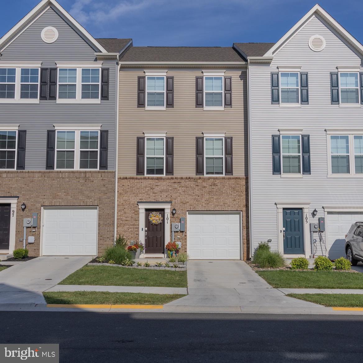 SELLER OFFERING UP TO $7,000 TOWARDS CLOSING ASSISTANCE WITH AN ACCEPTABLE OFFER. Welcome to this beautifully maintained, nearly new townhome offering 3 bedrooms, 2 full baths, 2 half baths, and 1,922 sq ft of modern living across three thoughtfully designed levels. The entry-level welcomes you with a spacious foyer featuring luxury vinyl plank flooring and a versatile rec room with plush carpeting—perfect for a home office, playroom, or second living area. Upstairs, the main living level boasts an open-concept layout with luxury vinyl plank flooring throughout. Enjoy a spacious family room that flows seamlessly into a stunning kitchen, complete with a large island, granite countertops, stainless steel appliances, and a dedicated dining area. Step outside to the composite deck with vinyl railing—ideal for outdoor dining or relaxing. On the upper level, the primary suite offers a walk-in closet and a spa-inspired ensuite bath featuring a dual-sink vanity and tiled shower with a built-in seat. Two additional generously sized bedrooms share a full hall bath, and a conveniently located laundry room completes the upper floor. Combining style, space, and functionality, this home is move-in ready—don’t miss your opportunity to make it yours!