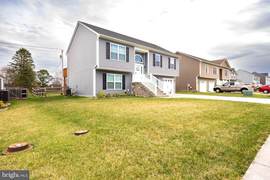 Great family home in a family friendly neighborhood! The spacious layout with multiple levels and plenty of bedrooms certainly appeals to growing families or for multigenerational living .  Located close to schools and shopping.  This 5 bedroom home has lots to offer. Main level has a great room with site lines to kitchen and dining areas.  The kitchen is fully equipped with stainless appliances,  breakfast bar and LVP flooring throughout the main living areas.  Access from the kitchen to a deck for grilling or enjoying a morning coffee. Custom paint in Primary bedroom with private full bath.  There are two additional bedrooms on this level and another full bath.  The lower level has LVP flooring in the family room.  Two additional bedrooms and another full bath on this level.  Patio door leads from the Family room to a patio and the fenced rear yard for outdoor living.