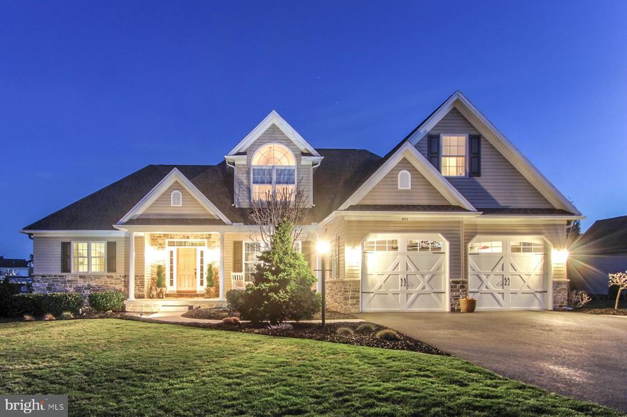 Welcome to 211 Evergreen Dr, a beautifully crafted 5-bedroom, 4.5-bath custom home located in the highly sought-after Indian Hills neighborhood of Boiling Springs. This home is truly an entertainer’s dream, offering over 3,350 square feet of finished living space, high-end finishes, and versatile design perfect for both everyday living and hosting.  From the moment you arrive, you’ll be impressed by the professionally landscaped yard and thoughtfully designed hardscaping, creating a stunning outdoor oasis perfect for relaxing or entertaining. Inside, you’ll find rich hardwood flooring, elegant crown molding, and detailed tray ceilings that add warmth and character throughout. The open-concept main level features a first-floor primary suite offering peaceful privacy, a grand great room, a formal dining space, and a private home office just off the chef-inspired kitchen—complete with custom cabinetry and solid surface countertops.
Downstairs, the fully finished basement boasts 9-foot ceilings, a spacious recreation room, full bathroom, wet bar, and additional bedroom —ideal for game nights, movie marathons, or easily converted into an in-law suite. With a 2-car attached garage, paved driveway, and access to the top-rated South Middleton School District, this home combines functionality with upscale living.  Perfectly positioned in one of Boiling Springs’ most prestigious communities, 211 Evergreen Dr offers the ideal blend of space, style, and location.  Newer HVAC and heat pump.  Don’t miss your chance to own this exceptional home in Indian Hills—schedule your private showing today!