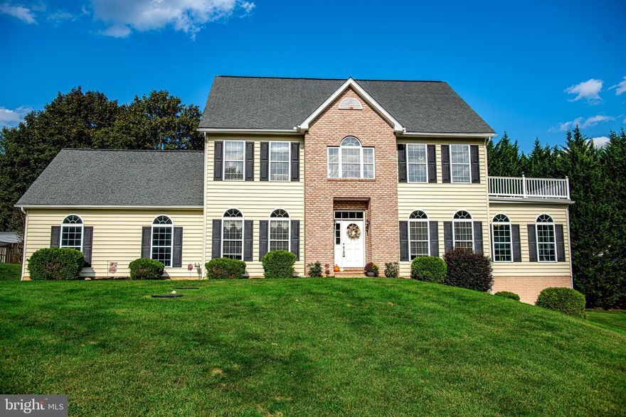 Supersized stately colonial sitting beautifully atop a one-plus acre lot. Partial brick front with two-car side load garage has beautiful elevation captivating your eyes from the curb. Enter at front and be greeted by warm welcoming hardwood that stretches throughout the main level. A two-story foyer shows off this wide entrance well. A formal living room sits to the right of the foyer with a formal dining room to the left. The center hall foyer stretches back to the kitchen as well. A gorgeous arched doorway brings a dramatic feel to entering the kitchen from the hall. The living room with large moldings allows entrance to the sunroom that sits adjacent this area. The sunroom offers flexible space and is drenched with natural daylight. The exit from this area leads to rear deck. The dining room features crown and chair moldings. The entrance to garage and a laundry room are tucked nicely into the space between the formal dining and kitchen. The kitchen is dressed in wood cabinets with crown. A large window is positioned perfectly over the kitchen sink. Stainless steel appliances and black counters. A breakfast nook completes the wrap around feel of functionality in this kitchen space that is complete with an island. The eat-in table space allows for a large table and features three large windows that overlook the rear yard. A desk or workspace is also present in this area. A family room sits off kitchen at rear of home with door to deck. A fireplace and a ceiling fan compliment this space. Double doors allow entry to living room at front, or they can be closed for privacy. The upper level provides generous size bedrooms and a wide hall. The primary bedroom sits to the right with a door that leads to the balcony. A walk-in-closet and hall leads to the primary bath. The primary bath features a dual vanity sitting on a ceramic tile floor, large soaking tub, and separate shower. A junior primary sits at the left front. This large bedroom features a double closet, ceiling fan, and full bath with tub/shower combo, single vanity, linen closet, & gorgeous window at front. The third bedroom on this level is placed at rear with double window, ceiling fan, and large closet. A full staircase to an upper level two is present in the wide hall. These stairs take you to two additional bedrooms that are spacious and offer large bench seats, large closets, and some architectural appeal with the ceiling lines at the roof. There is an unfinished area on this level that is currently used for storage. It has been set with electric (no plumbing) for an intended bathroom on this level. The lower level is fully finished and stretches the entire base of the home. There is room for living, dining, an efficiency kitchen with a window, and an exit to the rear. The current recreation space could be converted to bedroom space and allow for a full in-law suite. There is a full bath with a step-in shower. A drop ceiling with white Stratford tiles makes this space bright and functional even though it is below level. The rear yard oasis is awaiting your summer entertaining. A stone patio allows you to entertain with table and chair space. An above ground pool with wrap around deck sits off patio and is nestled into the yard yet set within mature trees for privacy. The deck allows for sunbathing and sitting pool side. There is so much here to see, and the possibilities are endless!! This home is a Forest Hill address yet sits near the Fallston and Jarrettsville lines (just off Morse Rd.) Conveniences to Bel Air as well as Hunt Valley and Cockeysville. Close to recreation and state parks.  *Plumbing pipes updated in 2020. Heat pump in 2022. *5424 Sq ft of FULL Living Space in this wonderful home!