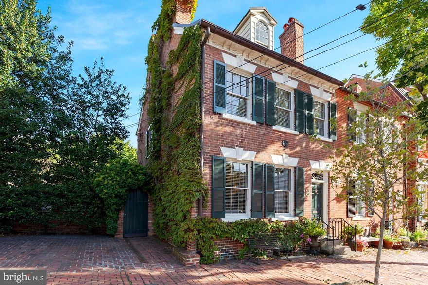 This exceptional Federal-style residence exudes historic charm with many original elements.  Circa 1795, many original features have been preserved:  heart of pine floors, four fireplaces with original mantels, handcarved archway in front hall,  detailed original moldings with bulls eye corners,  and two original staircases which make a statement that conjures up the beauty of yesteryear.   The double parlor living rooms each with a fireplace offer wonderful light.  Original doors and box locks throughout the home.  The beautiful dining room door with a fan light above and side lights is original, another element of a Federal house. A breakfast area with stone floor adjoins the kitchen.   4 generously proportioned bedrooms with natural light and  3 1/2 Ba provide individual spaces for a growing family.   An exceptionally large garden with boxwoods and  brick walkways are shaded by mature  landscaping.  Off street parking for 2 cars.