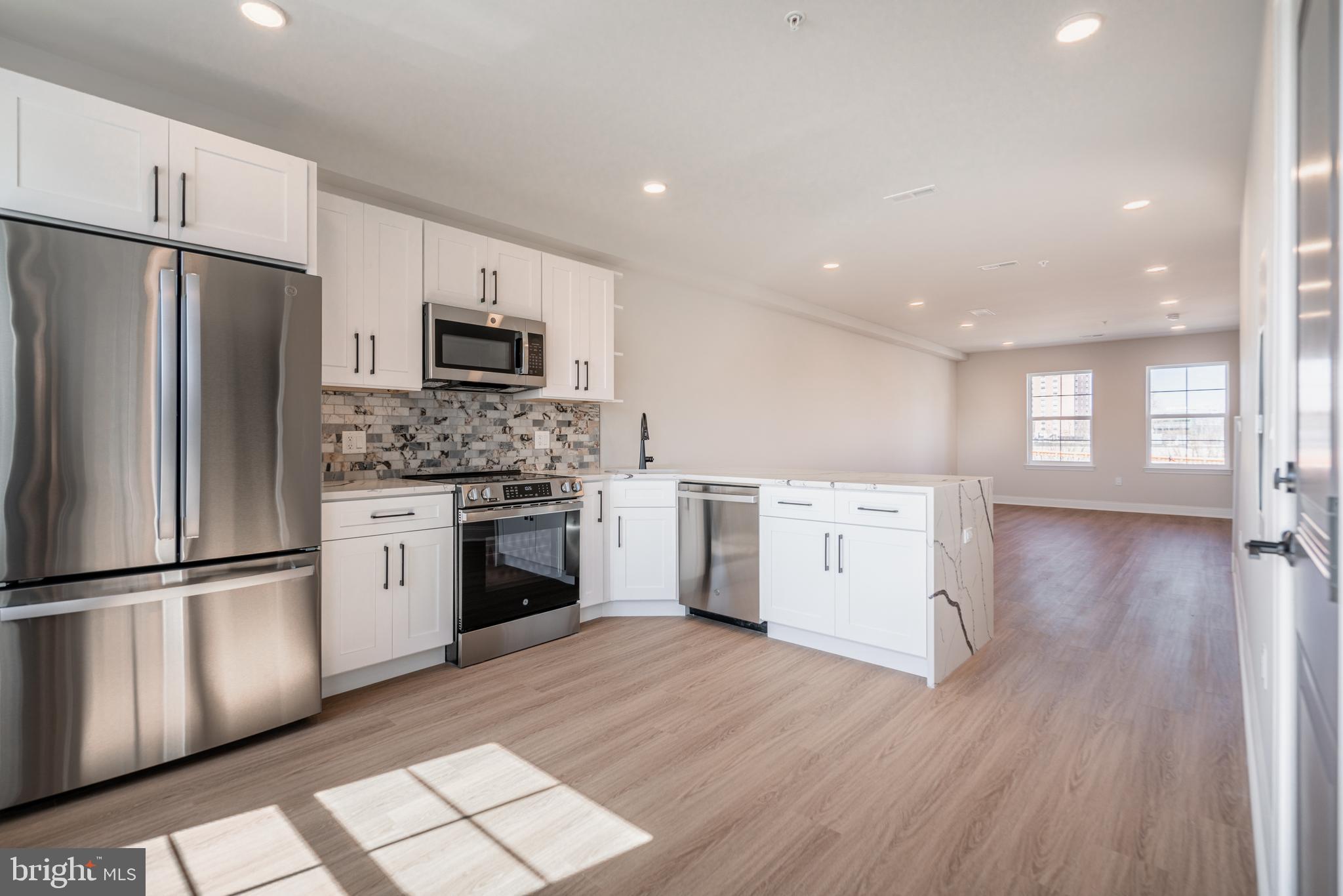 Welcome to your dream home nestled in the elite community of Wynnefield Heights Square, introducing a beautiful new construction condo at 4090 Conshohocken Avenue A8, Philadelphia PA. This chic residence boasts 3 spacious bedrooms and 2 modern bathrooms, all enveloped in the comfort of an energy-efficient HVAC system.
Step inside to find a meticulously crafted interior, featuring Quartz countertops that add an elegant touch to the sleek kitchen. Stainless steel appliances and high wall cabinets underscore the kitchen's modernity, while under-cabinet lighting brings warmth and functionality to your cooking space. The living areas boast beautiful white oak engineered flooring, creating a seamless flow throughout the home.
Natural light floods the space, highlighting the thoughtful details like wood baseboard molding and the cozy patio off the dining room - a serene spot for your morning coffee or evening relaxation. The chic exterior combines brick and vinyl siding, enhancing the building's charm and curb appeal. Awaiting approval, benefit from a 10-year tax abatement that promises affordability.
Assigned outdoor parking is available for $30,000, ensuring your vehicle's security just steps from your door for an additional fee. Embrace the future of living, available October,2025. Your oasis in Wynnefield Heights Square awaits.