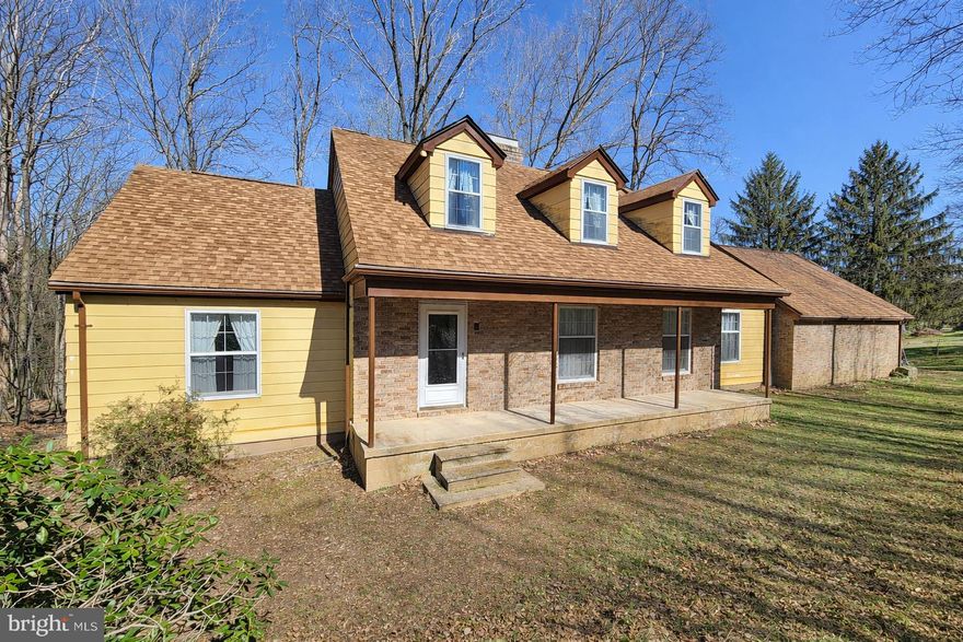 Welcome to a rare opportunity to own a solid, custom built Cape Cod nestled on over 27 acres of scenic countryside in Carroll County. An additional 3.9-acre parcel included in the sale, offering even more space and potential.

Lovingly maintained by its original owner, this 5 bedroom, 3.5 bath home showcases quality craftsmanship and timeless character throughout. Hardwood floors span much of the home, complemented by a traditional layout featuring spacious living and dining areas, built-ins, and a cozy brick fireplace that anchors the main living space.

The main level offers added flexibility with a bedroom and full bath, ideal for guests or multi generational living. Upstairs, you’ll find generously sized bedrooms with charming dormers, built in storage, and plenty of natural light.

The kitchen offers a functional footprint with solid wood cabinetry and opens to additional living space, ready for your personal touch. 

The full basement includes workshop space and additional storage, while outside, the property truly shines. Enjoy open land, wooded views, and the peace and privacy of rural living.  A barn/steel building provides endless possibilities for hobbies, equipment, or agricultural use, and established blueberry bushes and asparagus add to the homestead appeal.

Additional highlights include a 2 car attached garage and a newer roof (approx. 2 years old).

If you’ve been searching for acreage, privacy, and a well-built home with room to customize and grow, this is a must see.
