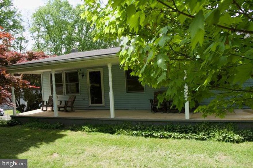 This is truly an outdoorsman's dream home!  Come take a look before it's gone.  This is basically an "as is" estate sale, my sellers want to leave everything  behind, furniture, dump truck, front end loader, log splitter, all toys and most tools (There are a few exclusions, but not many).  This rancher has 3 bedrooms (one is currently used as a laundry room but can easily be turned back into a third bedroom, there is a second laundry hook up in the basement) and 1 bath on the first floor, with an eat in kitchen and a large screened in porch to enjoy the secluded 3+ acre, tranquil and secluded lot .  The walk out basement has a 1 bedroom in-law suite.  The home has a brand new 12'x26' structure with a side entry door, a garage door and a new HVAC system.  This past year they put in a large 18 x 36 x 12 RV shed to house their motorhome with 30 AMP electric hook up and new LED lighting.  There is  3 bay garage that holds a 9000 # vehicle lift that is electric over hydraulic, with new 100 AMP power breaker box, new LED lighting with a 40,000 btu gas furnace and a wood stove with blower, there is also a 10 BTU AC.  a 12 x 24 shed with 100 amp power and air manifold, this shed is insulated and is heated and cooled.  a 12 x 26 garage with new LED lighting and a 12 x 26 wood shed that holds a Hardy 120 BTU outdoor wood furnace that heats the entire house.  There is a portable whole house generator that lights up the entire home, in case of a power outage.     The roof is less than 10 years old, there is a brand new propane furnace that was installed as a back up to the outdoor wood stove.  This home was is a one-owner house, the homeowner built the home and has cared for it meticulously through the years,   AND to make this a hunters dream, there is a 10 x 10 heated tree/hunting stand that was built in a tree behind the house.  The property sits between two large farms, it's ideal for hunting.  There is plenty of opportunity with this property to rent 1 or more of the garage bays, the in law suite or the motor home shed.  This is a one of a kind property, make an appointment to see it today.