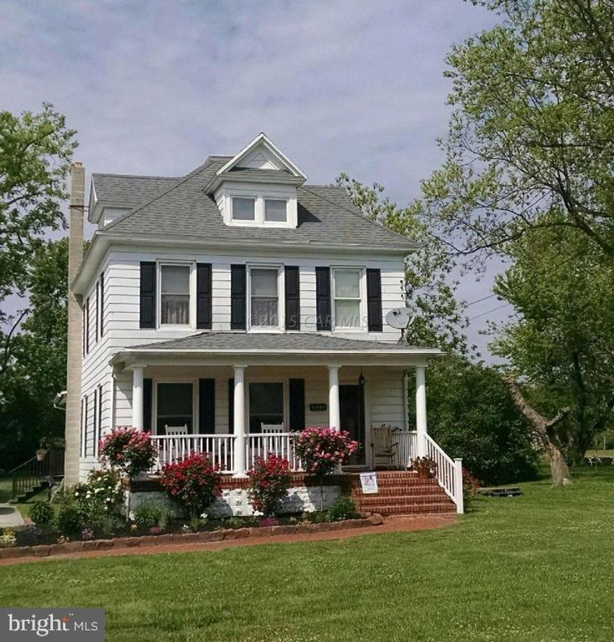 NEW PRICE! This home has the Old Charm of yesteryear with all the modern amenities. Well maintained with many upgrades. The home beams with pride of ownership! The home offers a gorgeous kitchen with granite counter tops, tiled flooring, skylight. The dining room has wood flooring and space for those family dinners. This home features a wood burning stove with a brick hearth in the living  room and a large family room for all of your gatherings. This home really shows its love! Enjoy the peace and privacy out on your large deck as you enjoy the view of your grapes, figs, and mature apple trees or you can gather the whole family and have that BBQ of a life time.  Relax on your brick front porch enjoying your morning coffee as the sun rises. City water and sewer without city taxes!