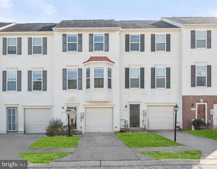 Welcome to this beautifully updated townhome in the highly sought-after Tanyard Springs community of Glen Burnie! Offering an array of resort-style amenities, including a pool, a fitness center, a clubhouse, playgrounds, tennis and basketball courts, a pavilion, and a brand-new community park with sports fields, this vibrant neighborhood provides everything you need for leisure and convenience.  Step inside to the ground level, where you'll find a versatile entryway, a powder room, and a spacious laundry room for added functionality. The attached one-car garage ensures effortless parking and storage.  The main level impresses with an open-concept layout, soaring ceilings, and luxury vinyl plank flooring. A bright bay window fills the space with natural light, while the living area seamlessly extends to a rear deck—perfect for entertaining or unwinding outdoors. The chef’s kitchen is a showstopper, featuring a center island with breakfast bar, granite countertops, stainless steel appliances, and an eye-catching decorative backsplash.  Upstairs, you’ll find two inviting bedroom suites, each offering plush carpeting for ultimate comfort. The primary suite boasts a walk-in closet and a double vanity, creating a private retreat.  Recent updates include luxury vinyl flooring, fresh paint, new carpet, updated kitchen counters, renovated baths, and stylish fixtures—making this home truly move-in ready.  Conveniently located near I-97, MD-100, and I-695, this home offers easy access to Baltimore, Washington, D.C., and beyond. Don't miss this incredible opportunity—schedule your private tour today!