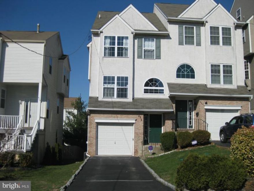 Welcome to this beautifully updated town home in popular Conshohocken Boro.  Enter into a light filled foyer with newly carpeted stairs.  The main floor of the house features an updated open kitchen concept with granite countertops, cherry cabinets, breakfast bar, and extended kitchen nook with a built in wine fridge!  The kitchen looks out into a large living room/dining room featuring well maintained hard wood floors, and access to a spacious back deck for grilling or relaxing.  A renovated powder room with newly installed vanity, new paint and new tile floors complete this level.  The lower level hosts a large one car garage with extra storage space, and huge rec room for watching sports!  Sliding doors lead you to another spacious deck.  The second floor offers a large master bedroom with walk in closet and newly tiled/painted master bedroom.  The second bedroom features vaulted ceilings and great natural light.  Completing this level is a large hallway bath and washer/dryer.  The third floor offers a huge living space that can be used as a large bedroom, office, or possibly two bedrooms!  The entire house has been recently painted!  Open house this weekend on April 6th - 1pm-3pm!