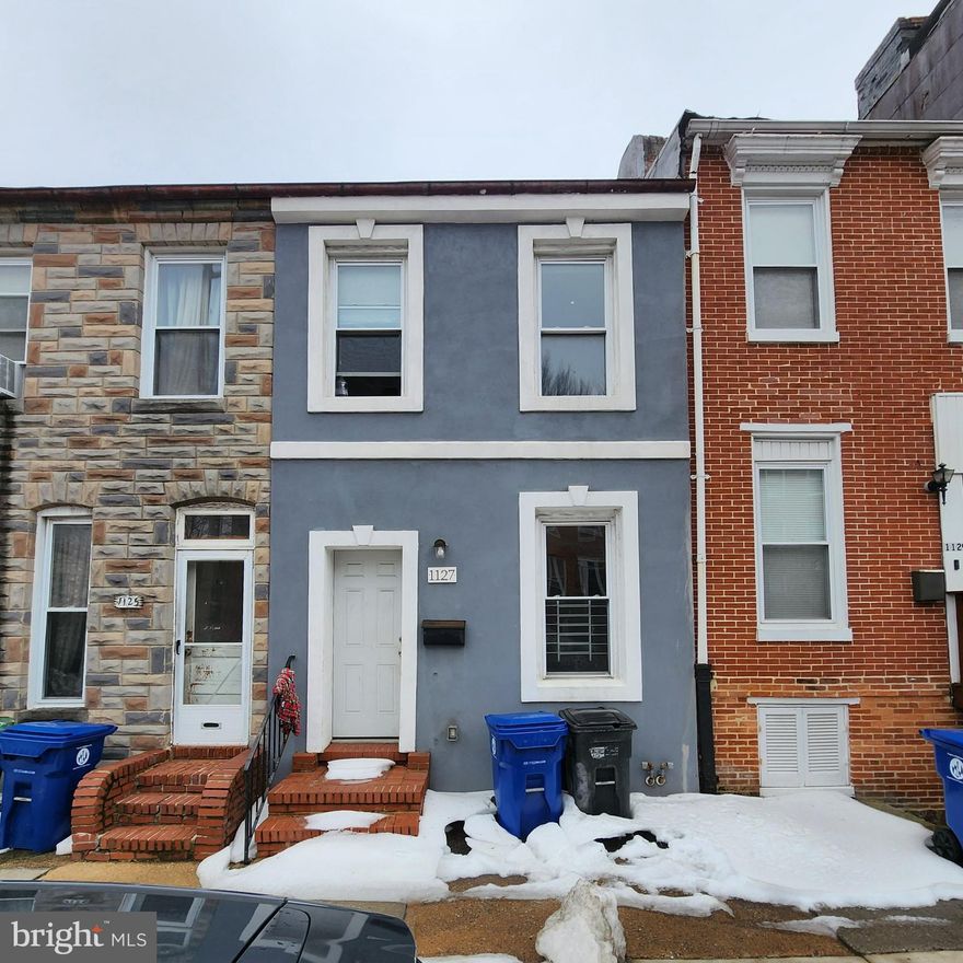 Located in the heart of Baltimore’s Hollins Market area, this 2-bedroom, 1.5-bath townhome offers strong value-add potential in a prime central location. Just minutes from the University of Maryland Medical Center, Camden Yards, M&T Bank Stadium, and major commuter routes, this property is well-positioned for rental demand or renovation upside. The home features gas service, a multi-level layout with above average sqft for this design, and a rear yard—an added bonus in this city setting. In need of updates and cleanout, but priced accordingly. Sold strictly as-is; seller will make no repairs. Excellent opportunity to renovate, hold, or customize in a well-connected location. Ground rent, to be verified by buyer. Seller will not redeem.