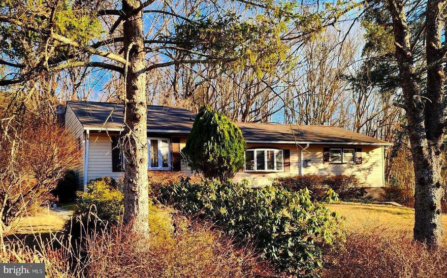 This charming home in the desirable LaVale neighborhood of Mountain Side, Maryland, offers an impressive 3,158 sq ft of finished living space. With 5 spacious bedrooms and 3 full baths, including a owner’s suite, this home has plenty of room for family and guests. Enjoy cozy evenings by the fireplace or host dinner in the separate dining room and eat-in kitchen.  The property features replacement windows, a lower-level oversized room perfect for a variety of uses, and an HVAC system that’s less than five years old. For outdoor enthusiasts, the home backs to serene woods, offering a spansive covered porch for both privacy and tranquility. Additionally, there’s a convenient storage shed for all your needs. Don't miss this one!