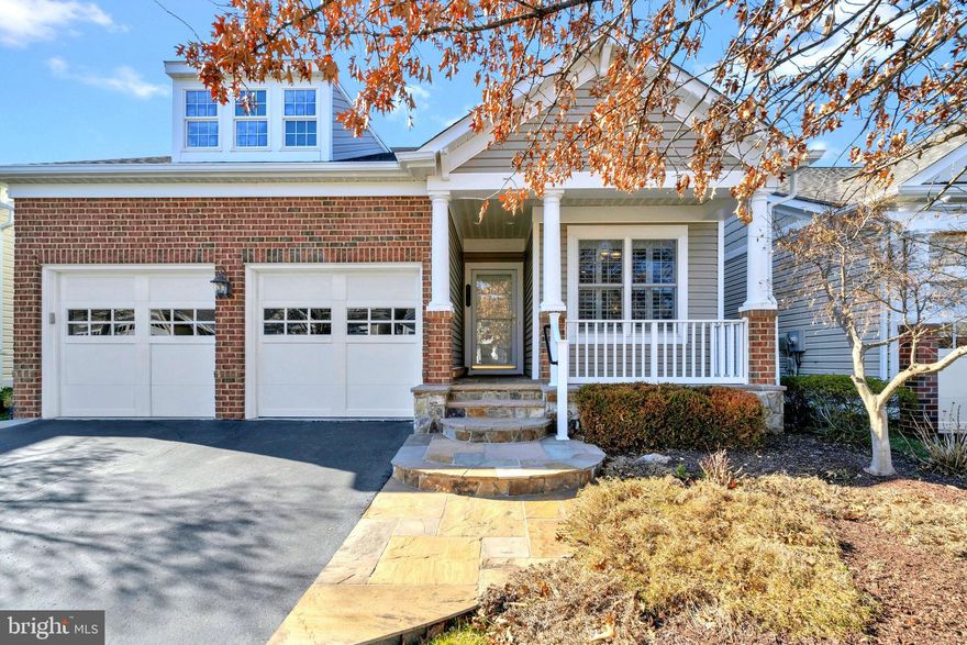 Active retirement community seekers, look no further than our vibrant Over 55 Community. This inviting space offers a front-facing kitchen featuring ceramic tile flooring, a charming breakfast nook adorned with plantation shutters, a sleek subway tile backsplash, chair molding, pantry, and a convenient pass-through to the dining room. Cook with ease using the five-burner cooktop, double wall oven with convection cooking, LG side-by-side refrigerator, Kitchen-Aid dishwasher, and built-in microwave.  Enjoy the spaciousness of 9-foot ceilings on the main level complemented by hardwood flooring, recessed lighting, two-piece crown molding, chair molding, and shadow boxing. Gather around the gas-burning fireplace in the family room, or unwind in the sunroom boasting floor-to-ceiling windows, ceramic flooring, and a refreshing ceiling fan. Step outside to the maintenance-free composite and vinyl deck with electric awning, perfect for relaxing outdoors.  Retreat to the main level owner's suite featuring a tray ceiling, full-length windows, crown molding, and a walk-in closet. The owner's bath offers a private water closet, double vanity, soaking tub with a picturesque window, full-size walk-in shower, and another walk-in closet. Conveniently located on the main level is the laundry room with front-loading appliances.   Completing the main level is a private office with built-in desk,  ceiling fan and wall-mounted TV, as well as a secondary bedroom with recessed lighting, a ceiling fan, and an adjoining full bath boasting ceramic flooring and a granite vanity top.  Ascend to the bonus loft area with hardwood flooring, a secondary family room, two walk-in closets with built-in organizers, a third bedroom with a walk-in closet, and an en suite bathroom featuring a seated shower and ceramic tile. The full basement with 9-foot ceilings offers ample space, including a large unfinished storage area with shelving, daylight windows, a carpeted recreation room with recessed lighting, a ceiling fan, and a conveyed pool table, along with a carpeted guest room/den, a fourth bedroom with two closets, a ceiling fan, and an en suite bathroom.  Completing this exceptional home is a two-car garage with epoxied flooring, extensive overhead storage, and a wall organizer. With its brick front and covered front porch featuring custom stone steps and entry, this community offers the perfect blend of comfort and luxury for active retirees.

This gated community comprises 149 single-family homes within a sprawling 47-acre development. Conveniently located within walking distance is the adjacent Liberty Market Shopping Center, which features a Lidl grocery store, boutique shops, and various dining options. Nestled within the gated community is Harmony at Spring Hill, an Assisted Living Facility.  Residents can enjoy a host of amenities, including controlled entry to an indoor pool, an exercise room with aerobics, and the option to rent the ballroom for events in the great room. Outdoor amenities include tennis and pickleball courts, bocce courts, and a Tot Lot.  An array of activities are offered, such as bridge, bunco, mah-jongg, poker and game nights, potluck dinners, special occasions, social events, educational presentations, and exercise classes. An on-site manager oversees the operations and facilities, ensuring a well-maintained and vibrant community atmosphere.  You don't need to worry about watering the lawn; the home has an irrigation system in place. HVAC 2021,  Washer 2021, Dryer 2019, Frig 2021, Roof is not original but exact age is not known.  The Homeowners Association (HOA) handles all maintenance for the exterior grounds. Out of 181 homes in the community only 49 homes have basements.