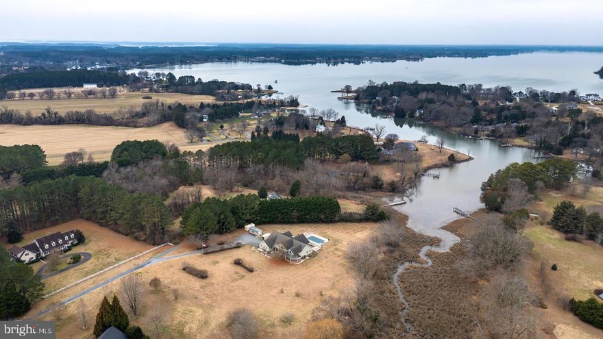 Experience exceptional waterfront living in this custom-built home set on a private,  3-acre lot. Designed to maximize comfort and connection to the outdoors.  The spacious floor plan includes a dedicated office, a cozy den and a gourmet kitchen. The oversized garage and separate laundry room are an added bonus to this perfect property.   This custom designed and built - one of a kind home is conveniently located between Easton and St. Michaels. Large  primary bedroom with ensuite bath.   Every bedroom features direct access to the expansive deck, creating a seamless indoor–outdoor lifestyle and offering the perfect place to enjoy  quiet moments.  Step outside to your own resort-like escape. The very large deck provides ample room for dining, relaxing, and entertaining, while the in-ground pool invites you to enjoy warm days in total privacy.  A rare combination of craftsmanship, serenity, and recreation, this waterfront property delivers an unparalleled living experience—perfect as a year-round residence or private retreat.