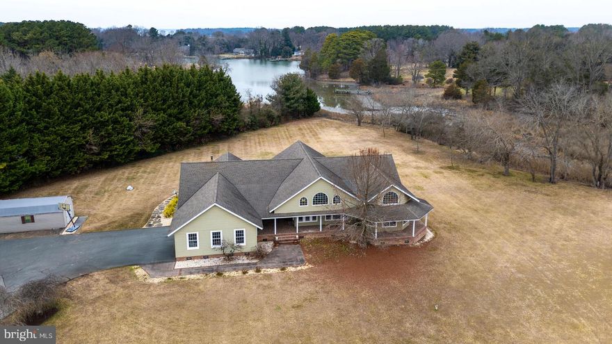 Experience exceptional waterfront living in this custom-built home set on a private,  3-acre lot. Designed to maximize comfort and connection to the outdoors.  The spacious floor plan includes a dedicated office, a cozy den and a gourmet kitchen. The oversized garage and separate laundry room are an added bonus to this perfect property.   This custom designed and built - one of a kind home is conveniently located between Easton and St. Michaels. Large  primary bedroom with ensuite bath.   Every bedroom features direct access to the expansive deck, creating a seamless indoor–outdoor lifestyle and offering the perfect place to enjoy  quiet moments.  Step outside to your own resort-like escape. The very large deck provides ample room for dining, relaxing, and entertaining, while the in-ground pool invites you to enjoy warm days in total privacy.  A rare combination of craftsmanship, serenity, and recreation, this waterfront property delivers an unparalleled living experience—perfect as a year-round residence or private retreat.