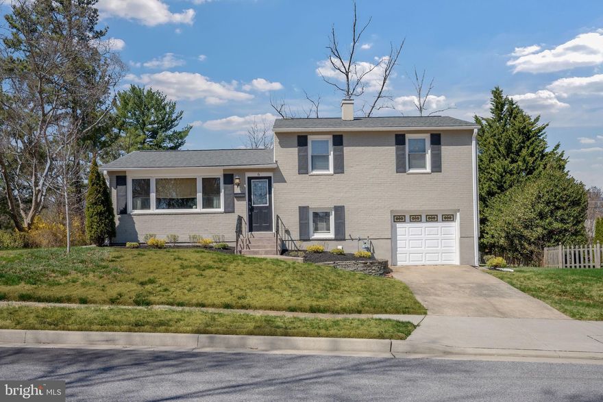 Renovated home in Lutherville’s Coveted York Manor! Recent improvements include a retiled hallway full bathroom (2026), a new roof and sheathing (2023), and a new water heater (2023), ensuring peace of mind for years to come. Gleaming hardwood floors extend throughout, creating a warm and inviting ambiance. The heart of the home awaits in the gourmet kitchen, featuring granite countertops, an updated backsplash, stainless steel appliances, and convenient stool seating. This space effortlessly flows into the open living area, highlighted by an electric fireplace, recessed lighting, and abundant natural light, perfect for everyday living or entertaining. A formal dining area rounds out the main level, ideal for gatherings of any size. Step down to the family room, a versatile space for relaxation or play. Upstairs, the primary bedroom suite offers a generous double closet and a spa-inspired en-suite with updated tile shower and granite-topped vanity. Two additional bedrooms are equally spacious and share a hallway bathroom with a tub/shower combo and granite vanity. Outside, a multi-tiered deck beckons for BBQs and summer evenings, while the expansive yard provides plenty of room for a swing set or outdoor fun. A one-car garage adds convenience, with extra parking available in the driveway. Ideally located near 695/83 and the vibrant York Road corridor, this home effortlessly blends comfort, style, and location - don’t miss the chance to make it yours!