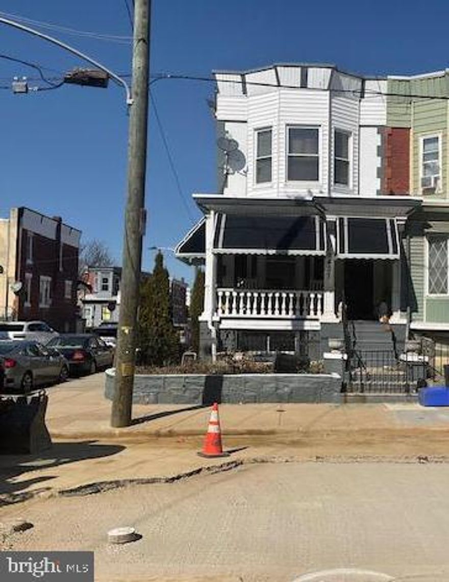 4 bedroom, 2 bath corner home with spacious front porch, side brick detailed exterior, full basement with  separate 2 car garage. The first floor features an eat-in-kitchen with tiled floors, stainless steel appliances,  granite countertops and access to the garage. Upstairs are three bedrooms and shared hall bath. 
Full basement with full bedroom and bath, another kitchen with granite countertops.  
Basement  has its own separate exterior side entrance or access from upstairs kitchen.  Home is sold in the condition it is in and buyer is responsible for obtaining U & O.