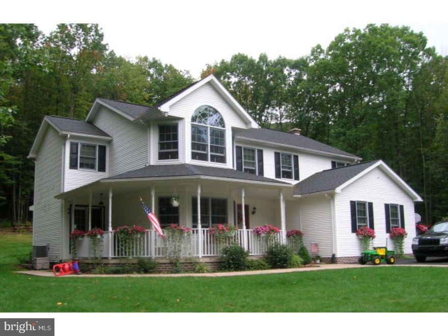 This home will check everything off of your wish list! Quality construction on 3.6 acres, wrap around front porch, concrete and brick patio with built in outdoor fireplace and gas grill, 1st floor family room as well as a finished lower level that will be the envy of your friends and family - a solid oak crafted bar accented by a gas fireplace, half bath also in lower lever, kitchen with breakfast bar and breakfast area, four bedrooms including a master bedroom with dressing area, bathroom with relaxing garden tub, convenient 2nd fl laundry, two car attached garage, central air. A rare find!  Mailing Address Continued: Ashland  Amp: 200