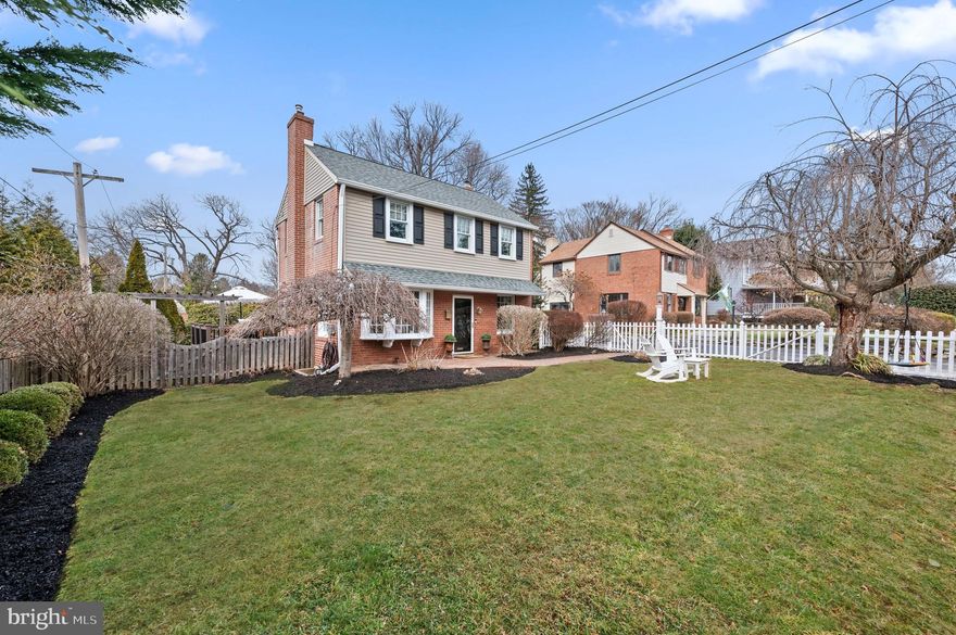 Welcome to 230 Lowry’s Lane in the highly sought after Conestoga Village neighborhood of Radnor Township. This picture perfect, white picket fence, house sits adorably on a fully fenced and oversized lot which makes it a rare find in one of Radnor’s most charming neighborhoods. Enter through the front door to find the spacious and sunlight filled living room equipped with a cozy wood burning franklin stove. From the living room you will find access to both the dining room and kitchen giving you an open (but not too open) concept floor plan. Enter into the tastefully designed dining room and you will be delighted to find a large bay window which floods the room with light, custom millwork and plenty of room for a large table to suit your entertaining needs. From the dining room you find a tasteful bar area, a nicely updated powder room and access to the spacious and private side deck which is fantastic for grilling and dining al fresco! Continuing inside you will find the eat-in kitchen with stainless steel appliances, granite countertops, white shaker cabinets and a custom pantry. Counter seating, a second bay window and breakfast nook round out the kitchen area. On the second floor you will find three spacious bedrooms with custom closets and an updated hall bath with white subway tiles and a shower/tub combo. On this floor there is also access to the temperature controlled attic providing ample storage. Just when you think it can’t get any better you will be pleased to find a beautifully finished basement with high ceilings making it the perfect playroom/office/gym - you name it! Laundry is also on the basement level. Enjoy the esteemed Garrett Hill 4th of July Parade right from your front lawn surrounded by mature plantings and professionally maintained gardens equipped with an underground sprinkler system. This home is conveniently located walking distance to Villanova University, Clem Macrone Park, Septa Trains and ample shops and restaurants. Schedule your showing today, this one won’t last! (Professional interior photos to come– showings begin Friday February 14th)