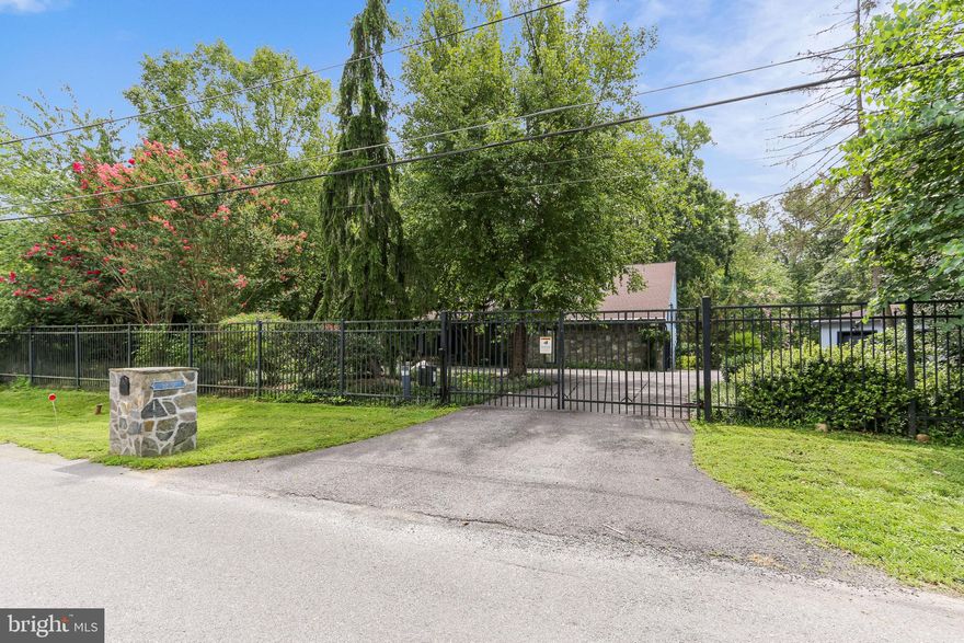 Exceptional opportunity to build on a level 1.11 acre setting within close proximity to Potomac Village.  Gated entrance.  Renovate or tear down the existing contemporary home.  House sold "as is." Wide lot with plenty of potential!  Bring your dreams!