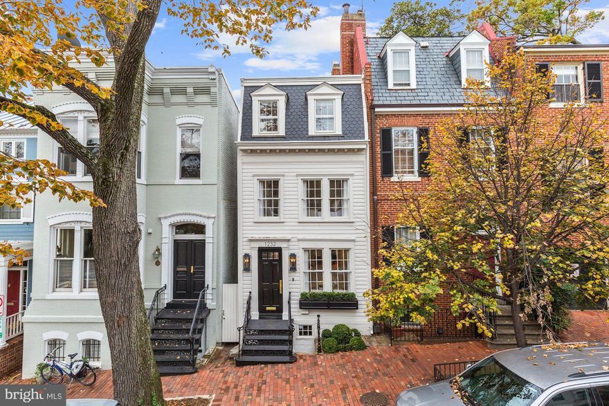 Elegantly situated in the heart of Georgetown, 1232 30th street is one of the most historic residences in Georgetown's East Village. Originally built in 1780, it was first owned by Nicholas Hedges, an accomplished contractor who built the nearby Evermay Estate. This stately home is one of only thirty 18th century buildings remaining in Georgetown.  Today, this historic residence stands tall once again behind its thoughtfully restored Federal-style facade. For the first time in centuries, it offers an unparalleled opportunity for modern luxury living thanks to a comprehensive designer renovation by Akseizer Residential. Three finished levels boast three bedrooms, two full bathrooms and one half-bath, Waterworks finishes, top-of-the-line Thermador appliances, herringbone-patterned white oak hardwood floors, custom-built cabinetry, smart-home technology, and a beautifully manicured deep private garden awash in Western light. A gracious lot size spans 120 feet in length, a rarity in Georgetown.   Ideally located only a half-block M Street, it offers easy access to premier shopping and fine dining establishments along Georgetown s main thoroughfare. Two doors away is the historic Gray-Pyne Estate at 1224 30th St, NW. The Gray-Pyne Estate just contracted within three days of coming to market at an asking price of $8.95M.