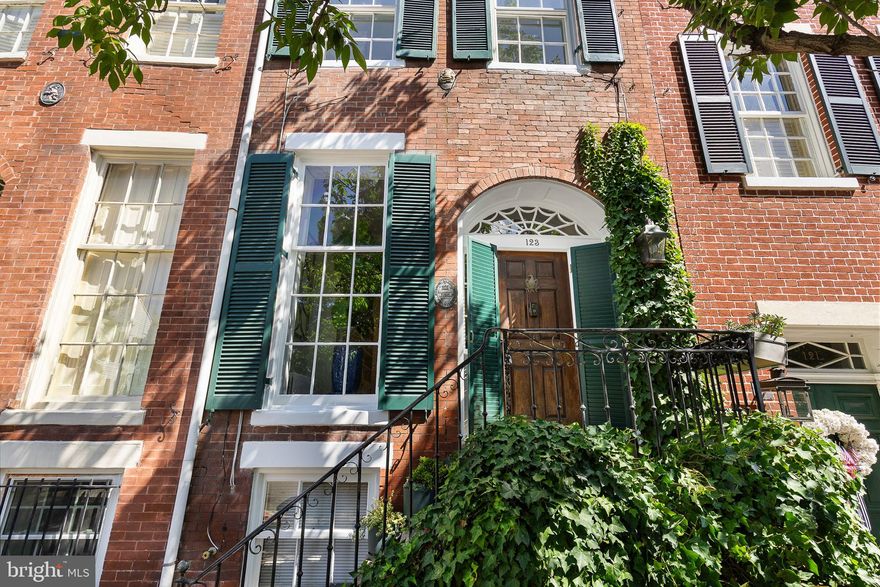 NEW PRICE ADJUSTMENT!
Step inside through the graceful Palladian fanlight entry to find 10-foot ceilings, heart pine floors, and four fireplaces that showcase the home’s rich history. Sun-filled rooms, designer lighting, and exquisite millwork set a refined tone from the moment you arrive.

Modern updates include fully renovated bathrooms both with beautiful original exposed brick, an updated kitchen, and smart-home features throughout. The kitchen opens to a private, brick-walled patio, perfect for entertaining or relaxing outdoors.The upper levels offer a spacious primary suite with renovated bath, two additional bedrooms, and another stylish full bath. The versatile lower level includes a new half bath, laundry area, and flexible space ideal for a family room, guest suite, or home office, brightened by a skylit cellar staircase.
Conveniently located just one block from Alexandria’s waterfront and the shops, restaurants, and cafes of King Street. Easy access to the King Street Metro, Washington D.C., Reagan National Airport, GW Parkway, and I-495/95 makes this a perfect home for commuters.