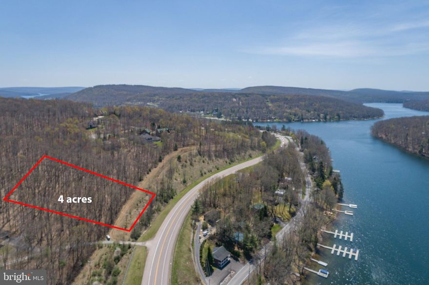 DEVELOPMENT OPPORTUNITY! This 4 acre parcel offers beautiful lake views and is right in the heart of Deep Creek Lake. Enjoy this property to yourself to build mountain lake dream home, or subdivide into up to 4 residential lots. Public Sewer is available. Centrally located just minutes from State Parks, Wisp Resort, Local Marina’s and Restaurants. Call today for more information!