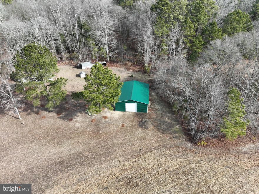 Discover the potential of this expansive 2 acre lot quietly nestled in Quantico, MD, just a 20-minute drive to Salisbury. Whether you're dreaming of building a custom home, starting a hobby farm, or expanding your business, this property is a versatile blank canvas ready for your vision. Included on the property is a spacious 36x35 steel building, perfect for storing equipment, tools, or working on personal projects.  Enjoy the peace of country living with the convenience of nearby city amenities. The possibilities here are endless—come see what your future could look like on this unique piece of land! There is also an older house on-site, currently not habitable.